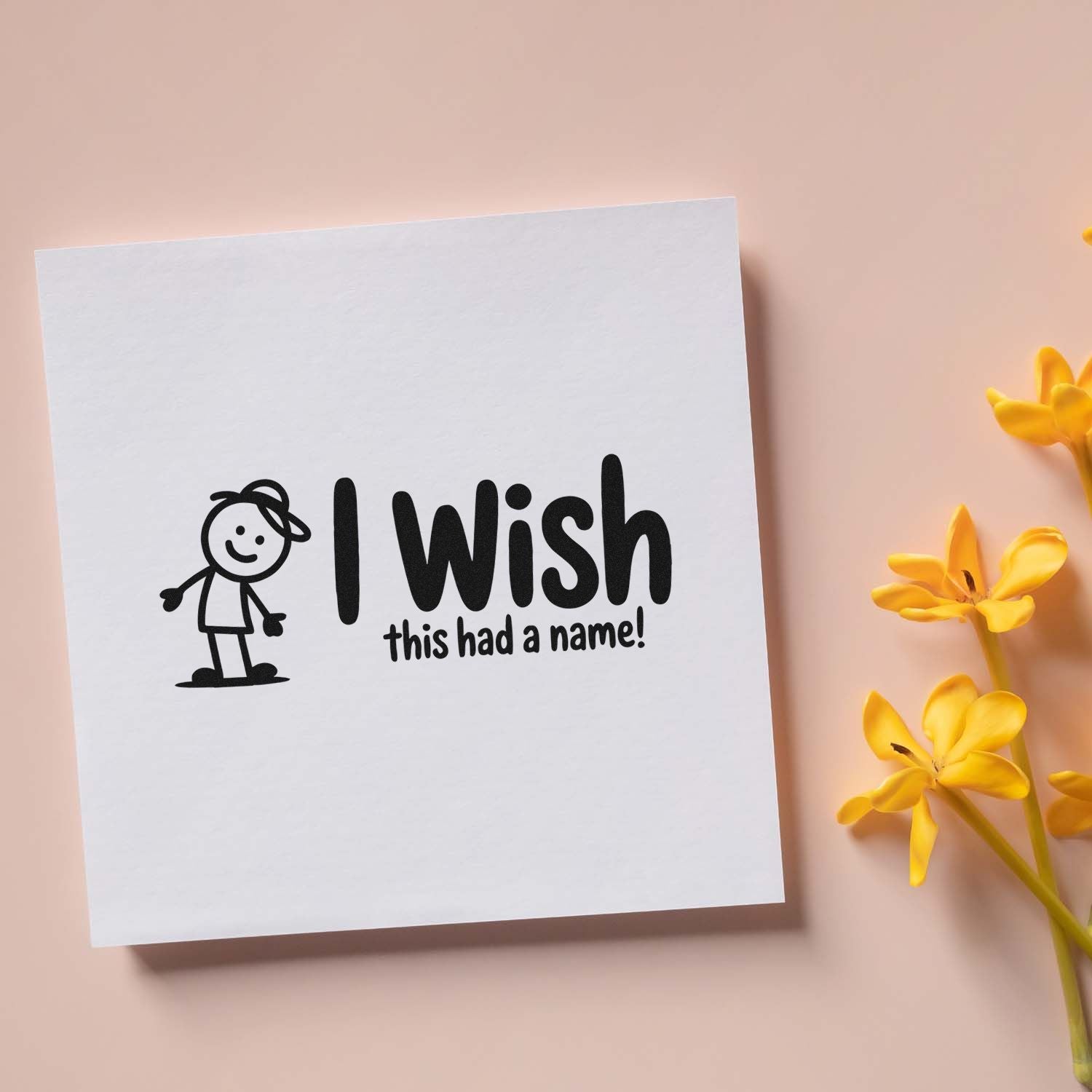 Funny rubber stamp design reading I wish this had a name! with a playful stick figure illustration on white card.