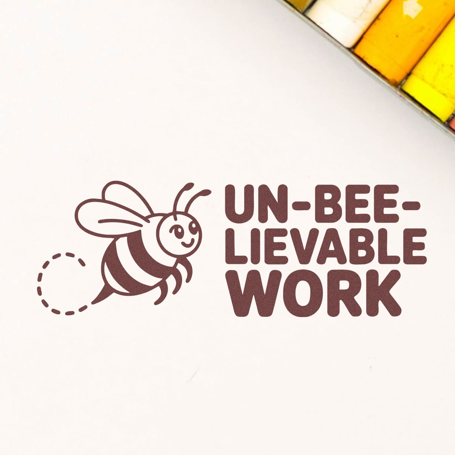 Bee-themed rubber stamp design reading UN-BEE-LIEVABLE WORK for office, teacher, or craft projects.