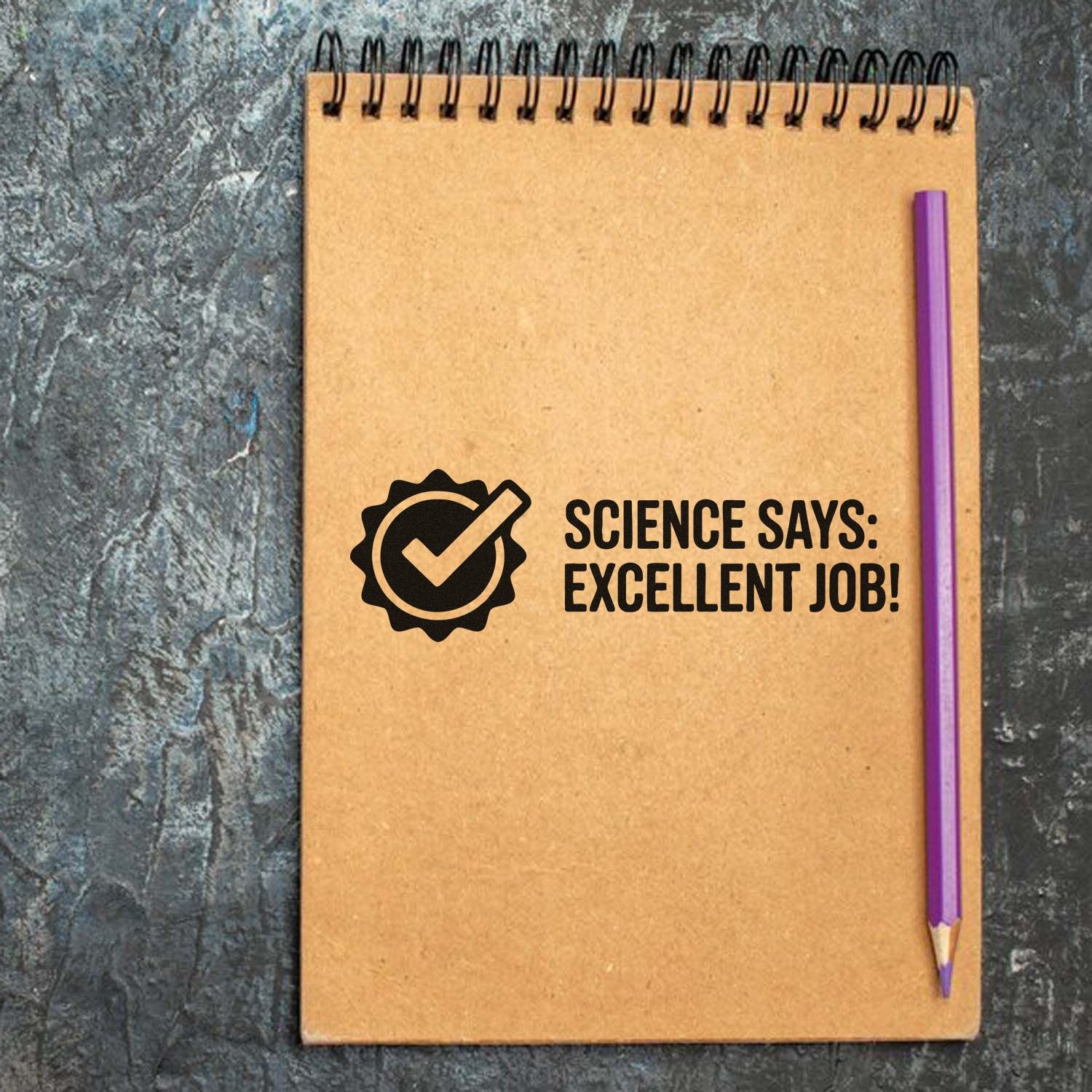 Science Says Excellent Job rubber stamp on notebook, perfect teacher reward stamp for student work and classroom praise.