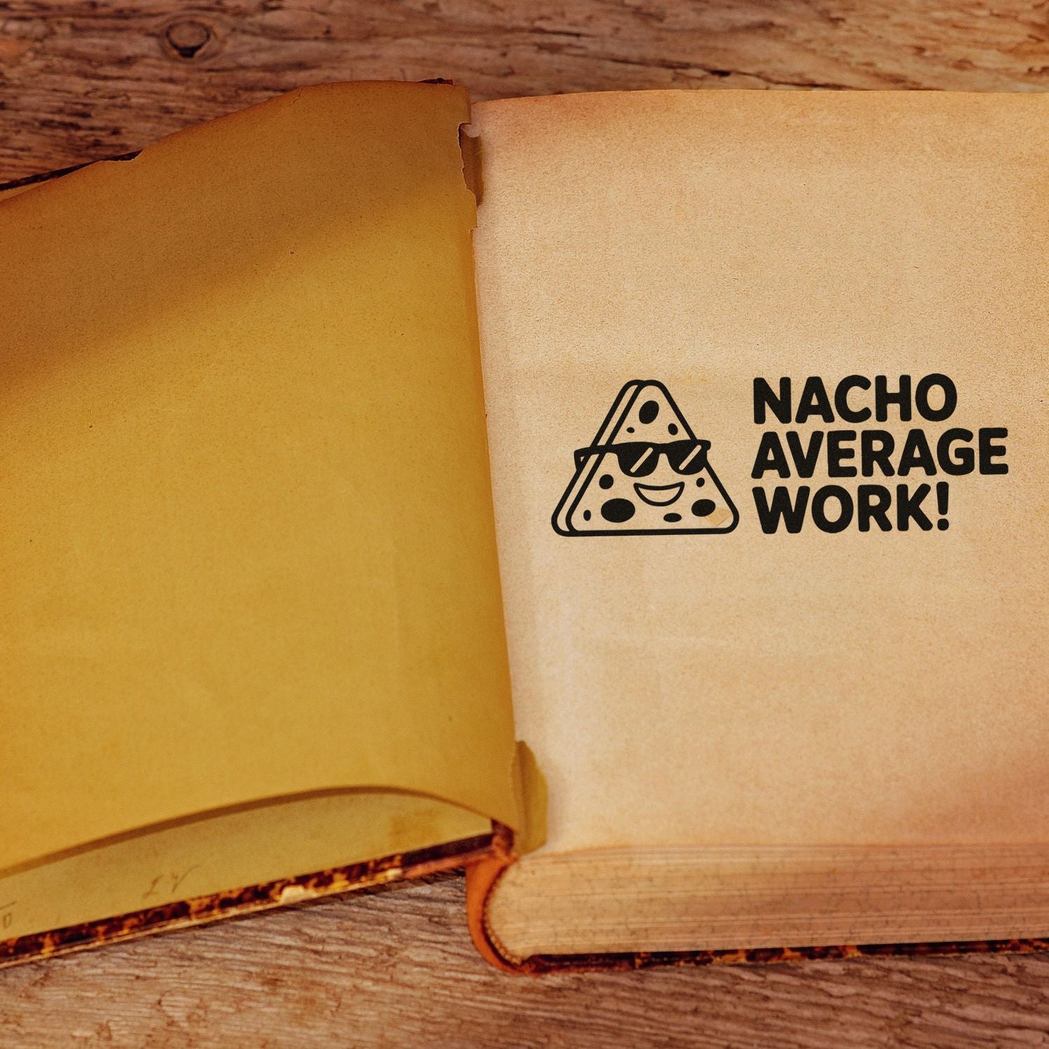 Funny Nacho Average Work rubber stamp on open notebook, a playful custom stamp for teachers, office gifts, and crafts.