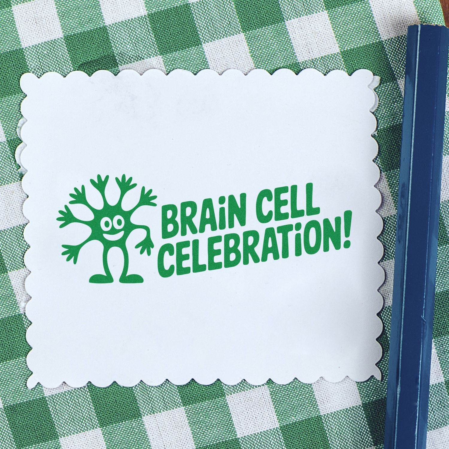 Brain Cell Celebration rubber stamp for science crafts, featuring a playful cell character and bold green lettering.