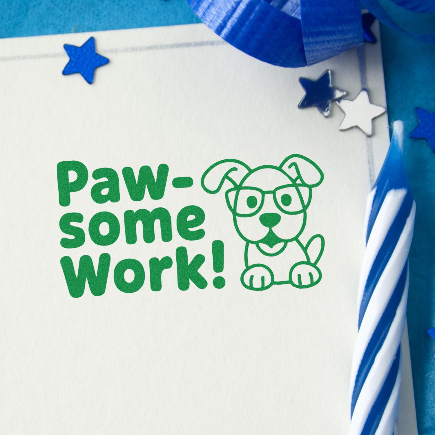 Paw-some Work! dog rubber stamp in green on paper, with blue stars and ribbon for teacher or pet-themed rewards.