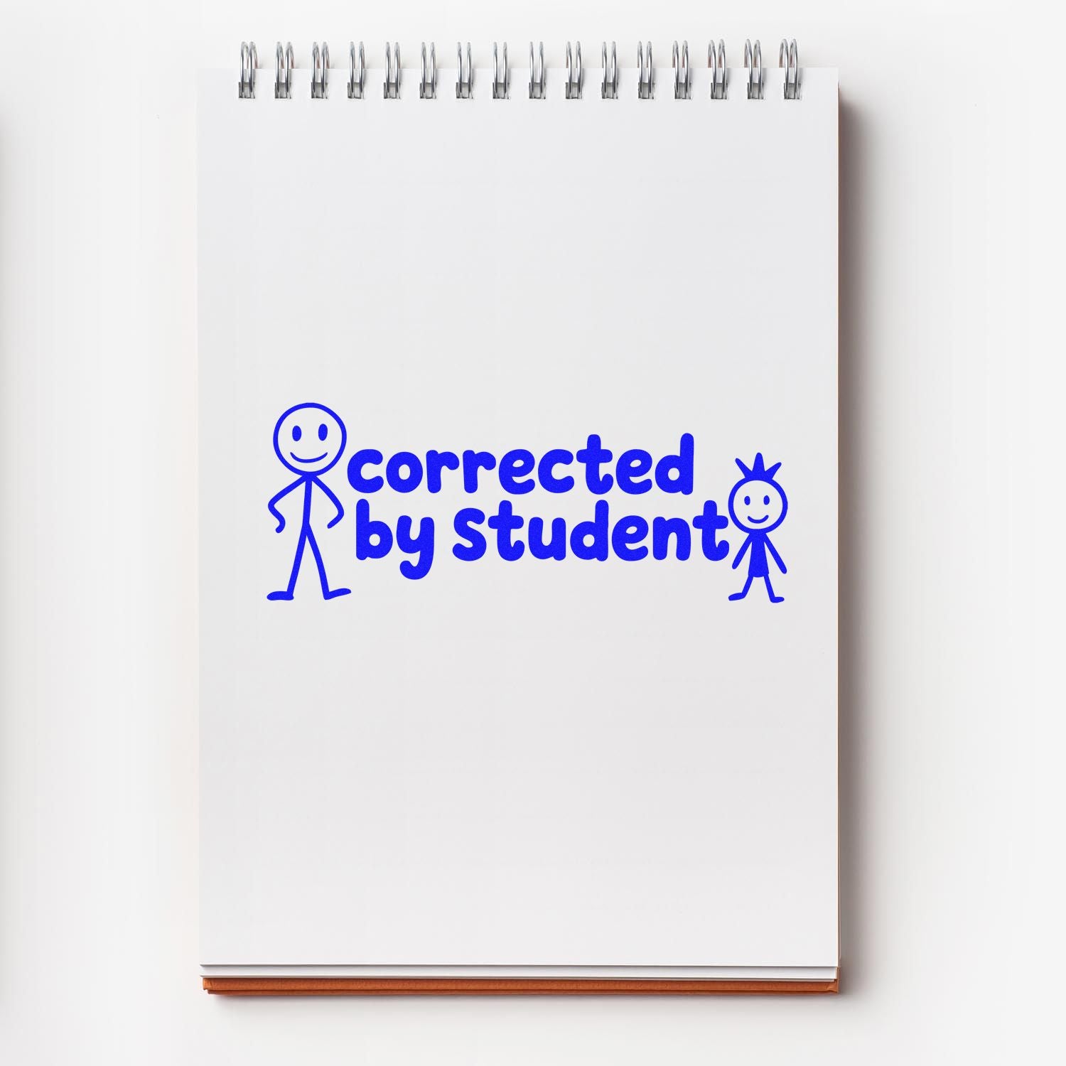 Blue rubber stamp design reading Corrected by Student on a notebook page, ideal for teacher grading and classroom use.