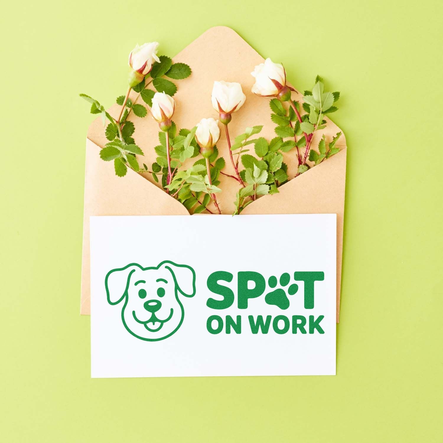 Custom dog-themed rubber stamp mockup reading Spot On Work on a card in an envelope with flowers.