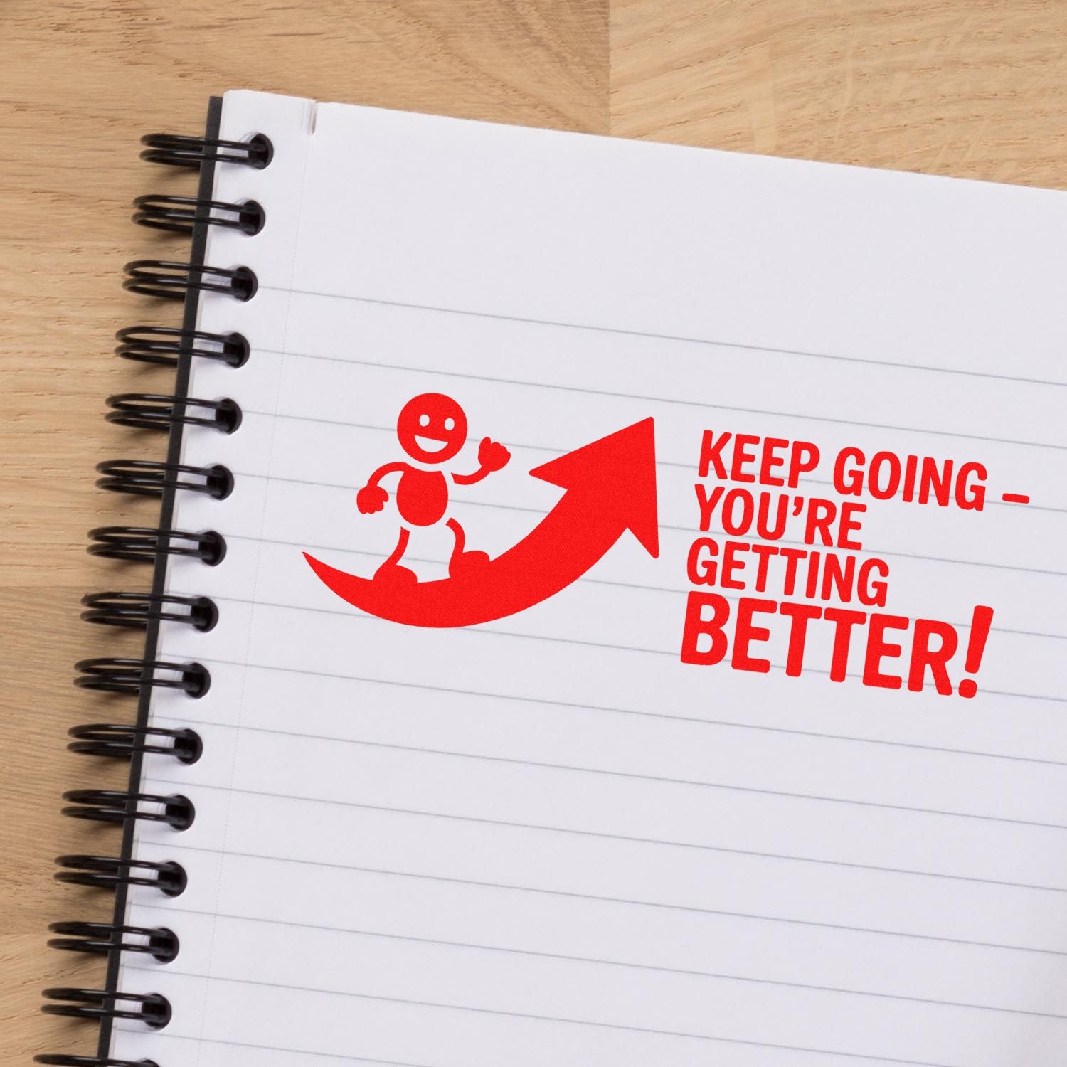 Motivational rubber stamp design reading Keep Going  Youre Getting Better! with red arrow for encouragement.