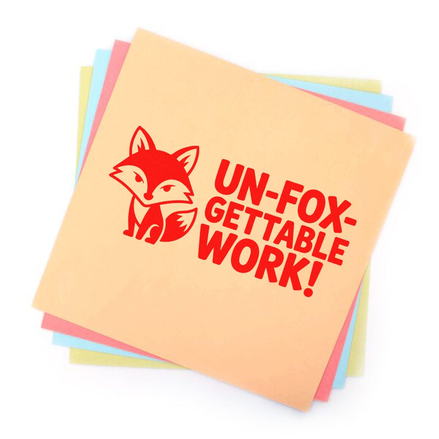 Custom rubber stamp with fox logo and UN-FOX-GETTABLE WORK! slogan on stacked colored paper.