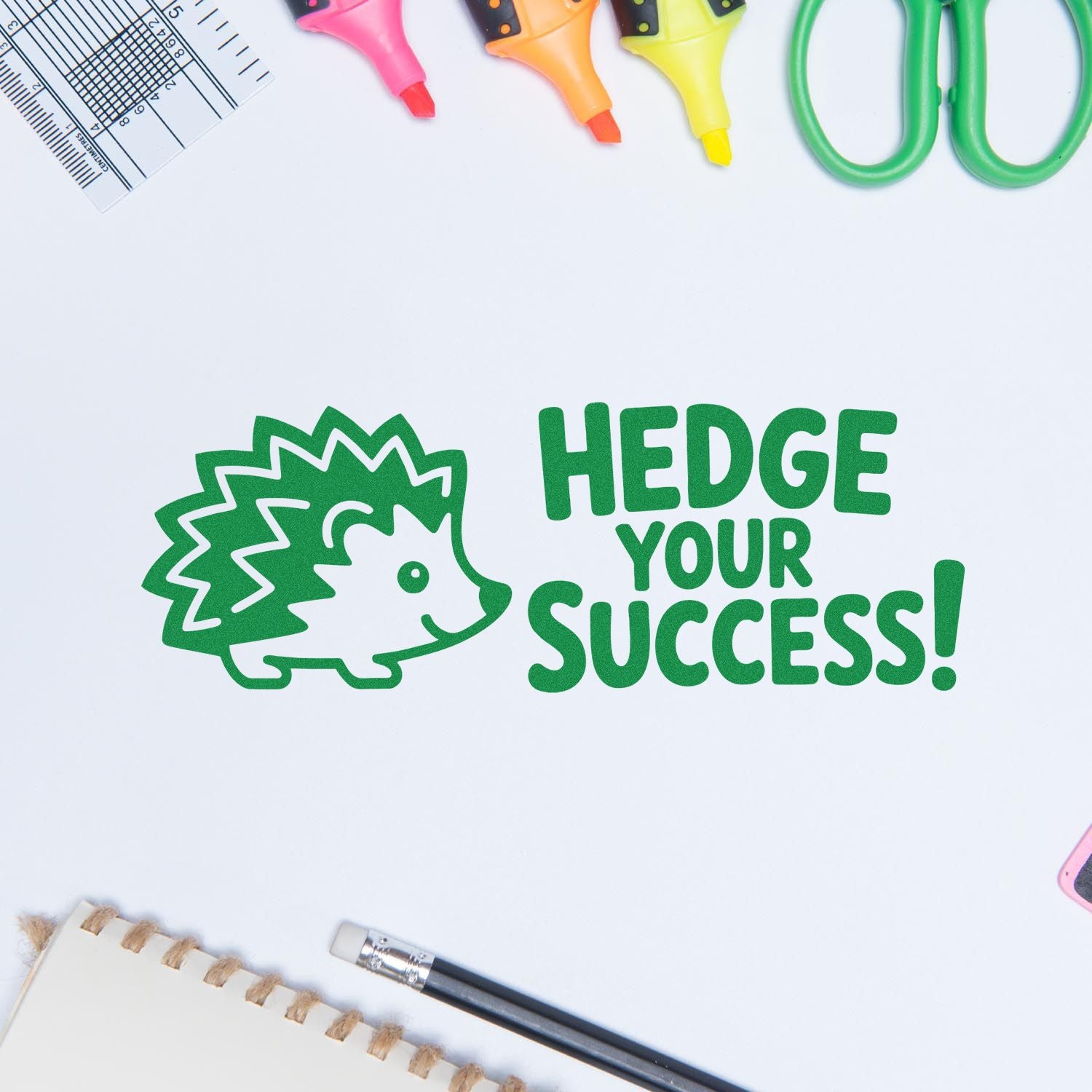 Green hedgehog rubber stamp design with Hedge Your Success! message on a clean craft workspace.