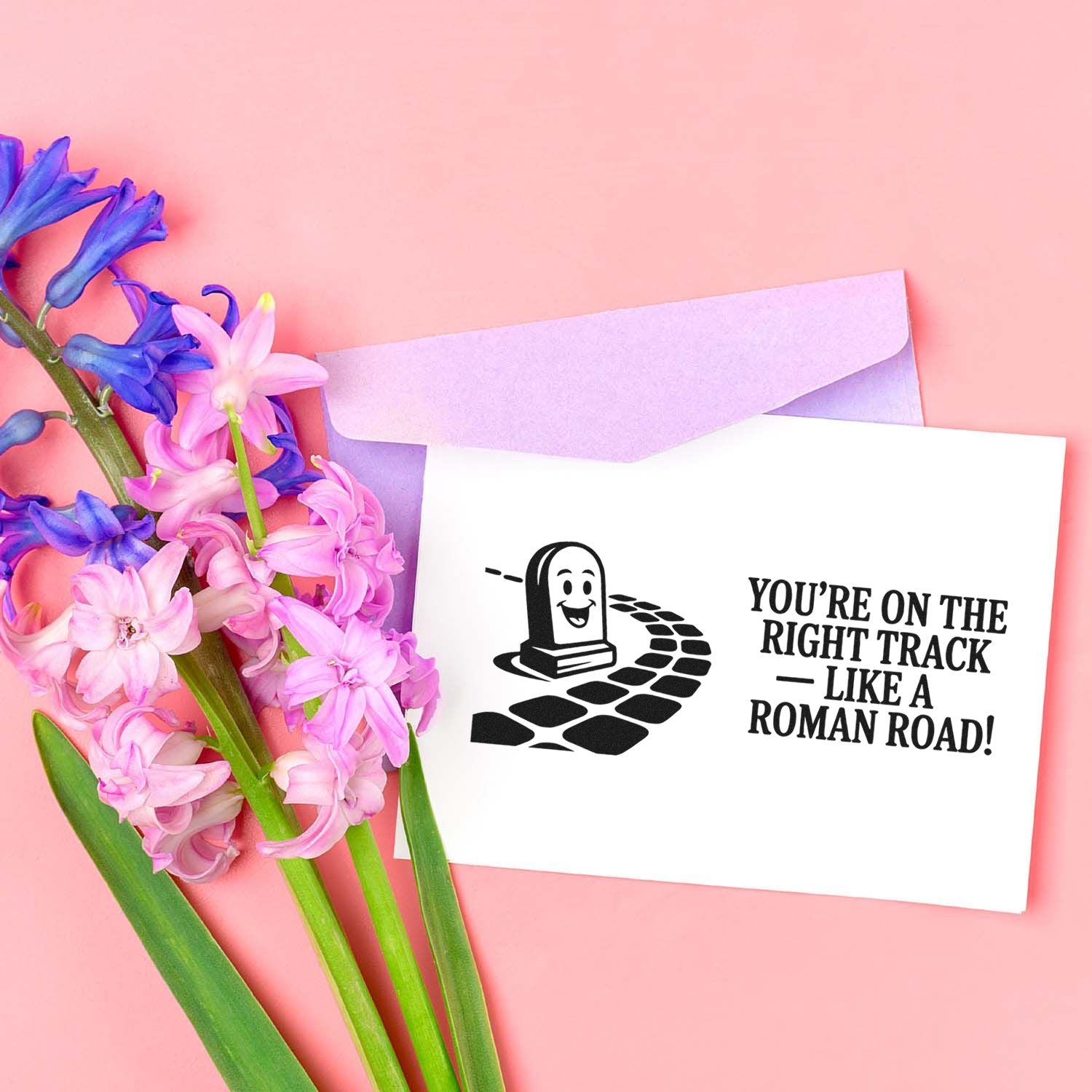 Funny Roman road rubber stamp greeting card with floral envelope and Youre on the right track like a Roman road! sentiment.