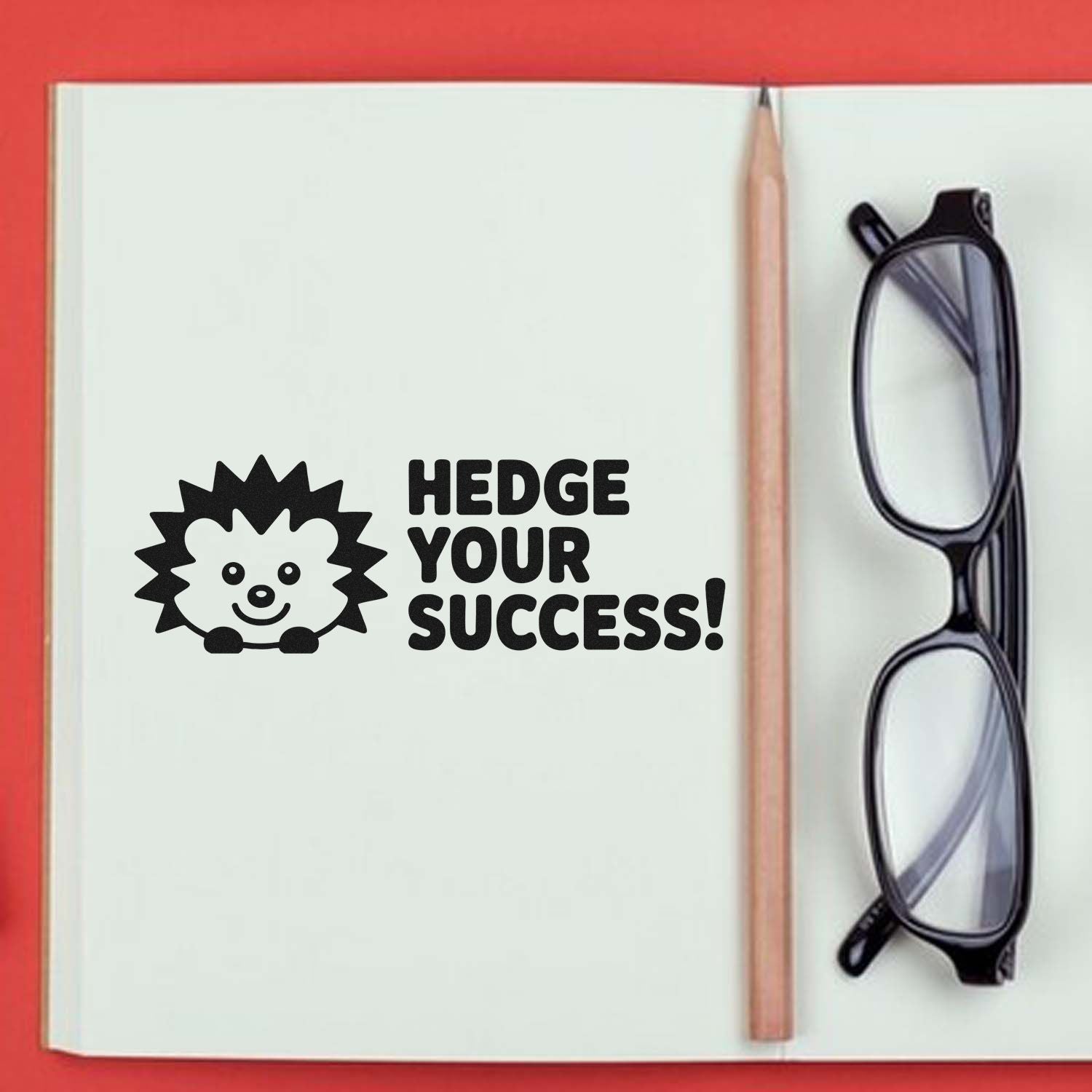 Hedge Your Success rubber stamp with hedgehog design on notebook, a motivational office stamp for planners and journals.