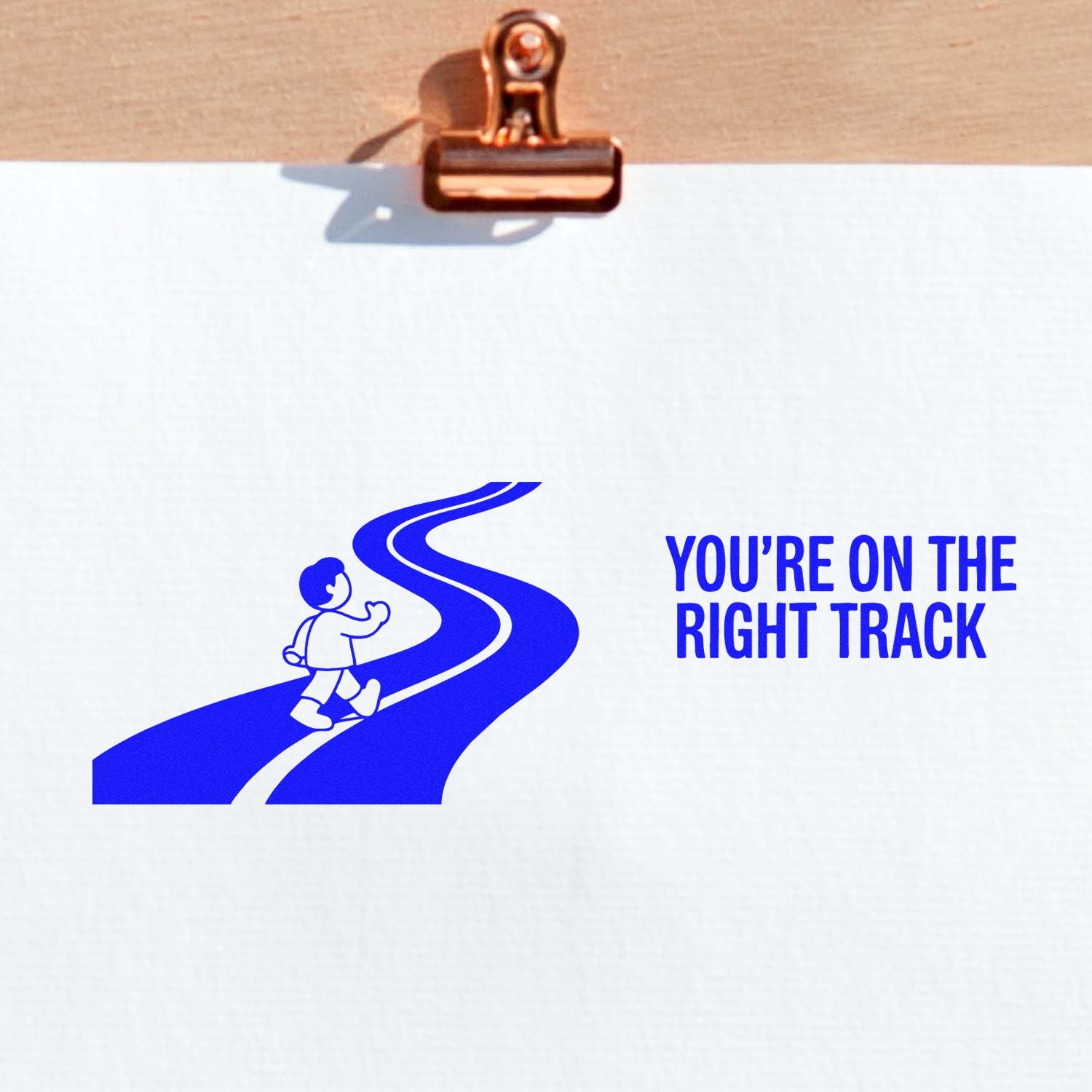 Motivational rubber stamp design with child on a road and text, Youre on the Right Track.