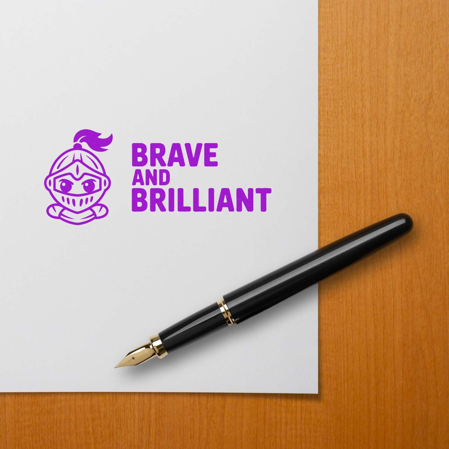 Custom rubber stamp mockup with Brave and Brilliant purple knight design on paper beside a fountain pen.