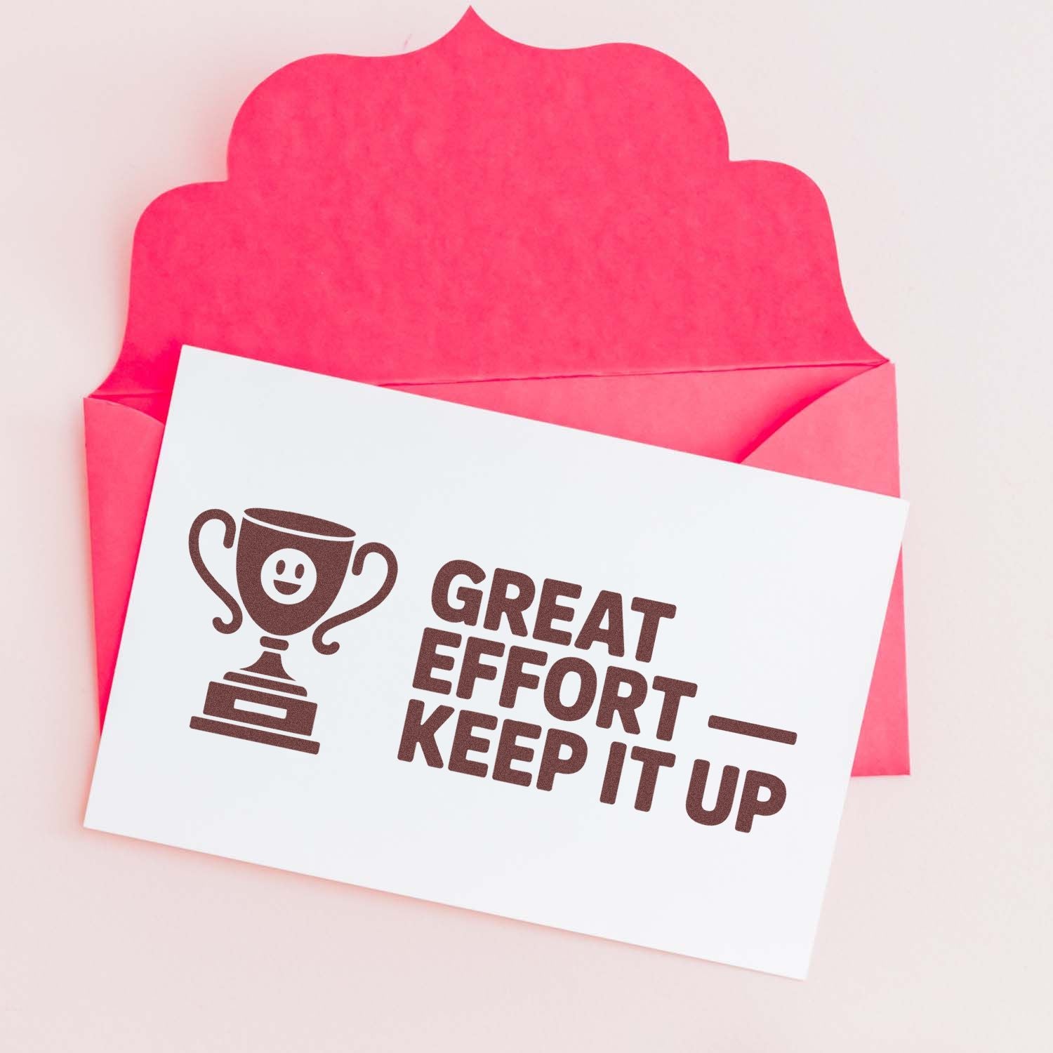 Motivational rubber stamp with trophy icon and Great Effort Keep It Up message for teacher feedback and reward cards.