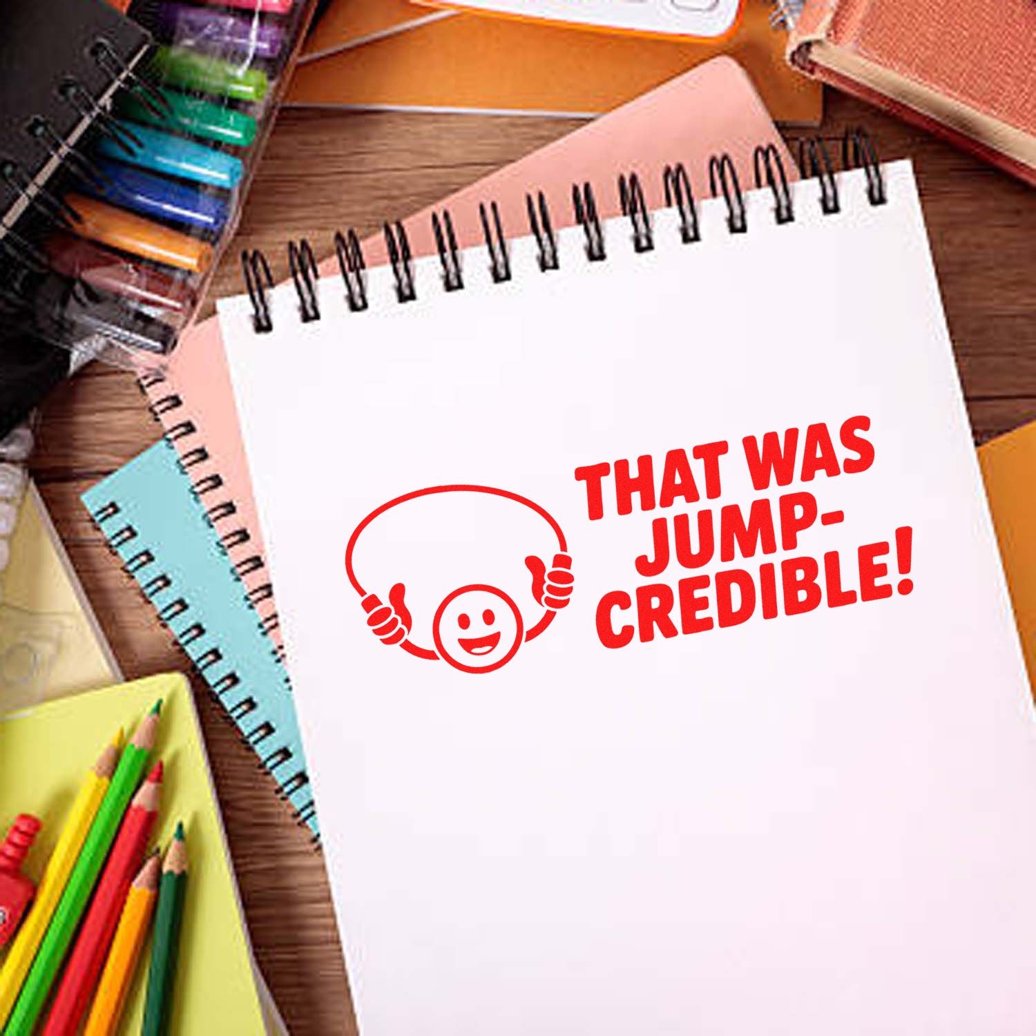 That Was Jump-Credible! rubber stamp design on notebook, perfect for classroom rewards, teachers, and craft projects.