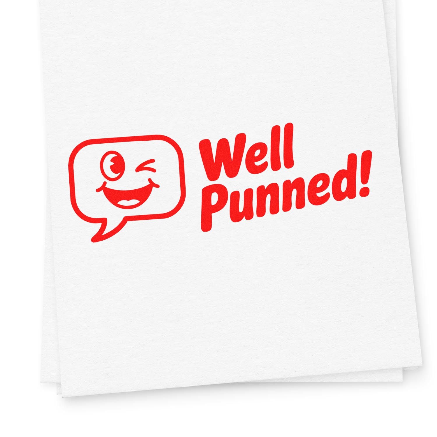 Red Well Punned! rubber stamp design with winking speech bubble face, ideal for punny cards and craft projects.