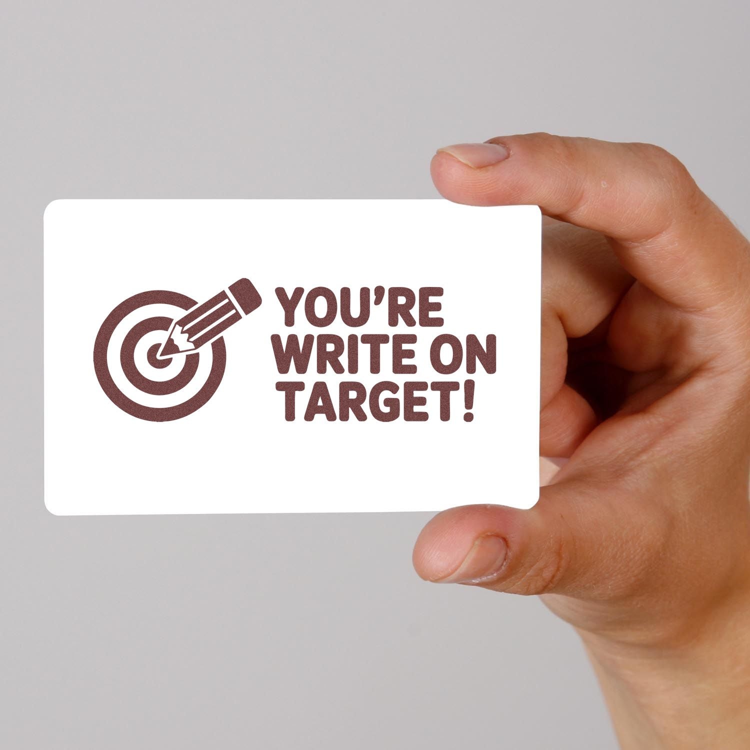 Personalized rubber stamp design with target icon and Youre Write on Target! message for teachers, offices, or stationery.