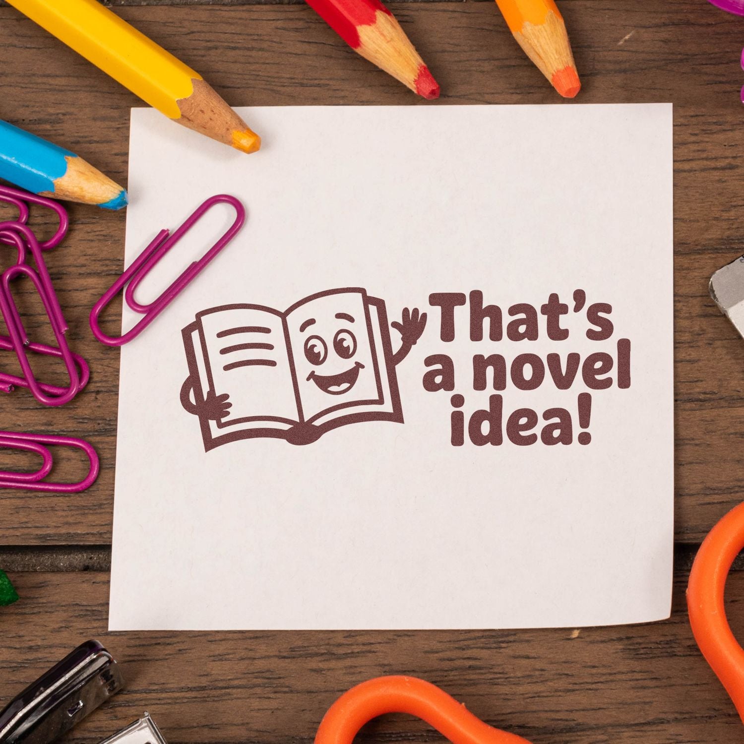 Thats a novel idea! rubber stamp with smiling book graphic for teacher, reading, and book-themed projects.