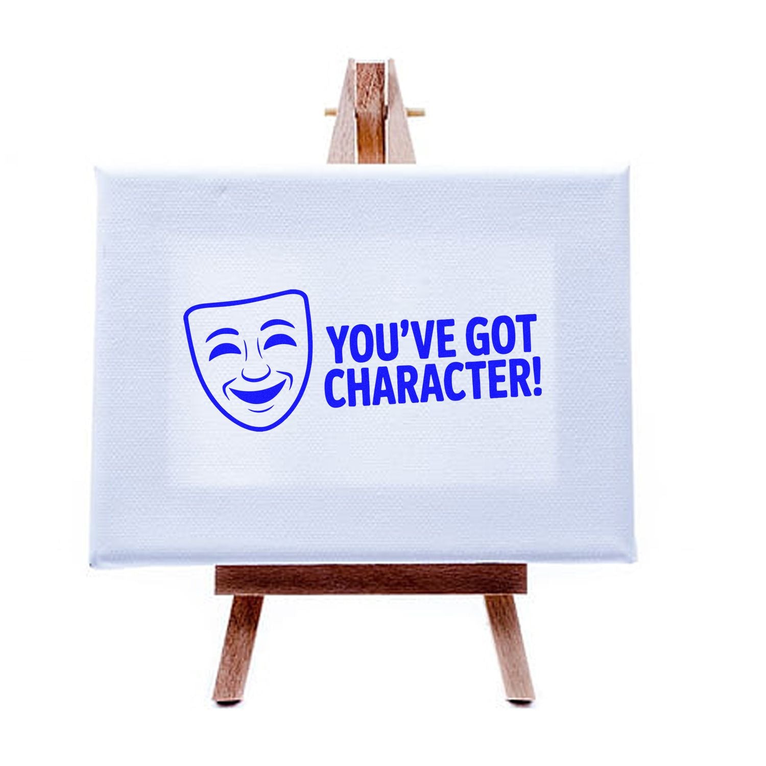 Youve Got Character! theater mask rubber stamp design displayed on canvas easel, ideal for custom arts and crafts branding.