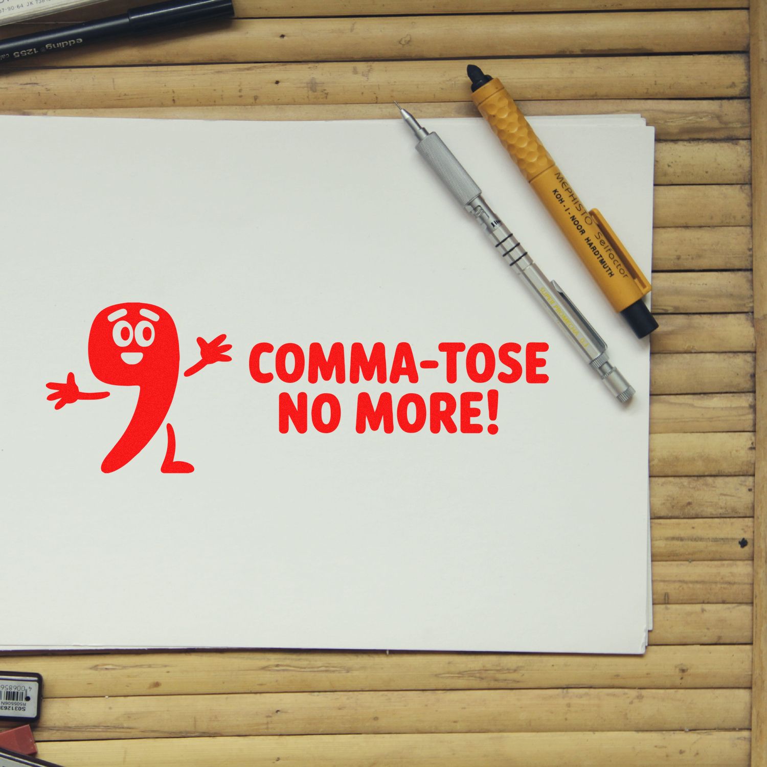 Rubber stamp design saying Comma-tose No More! with red comma character, ideal for writers, editors, and punctuation lovers.