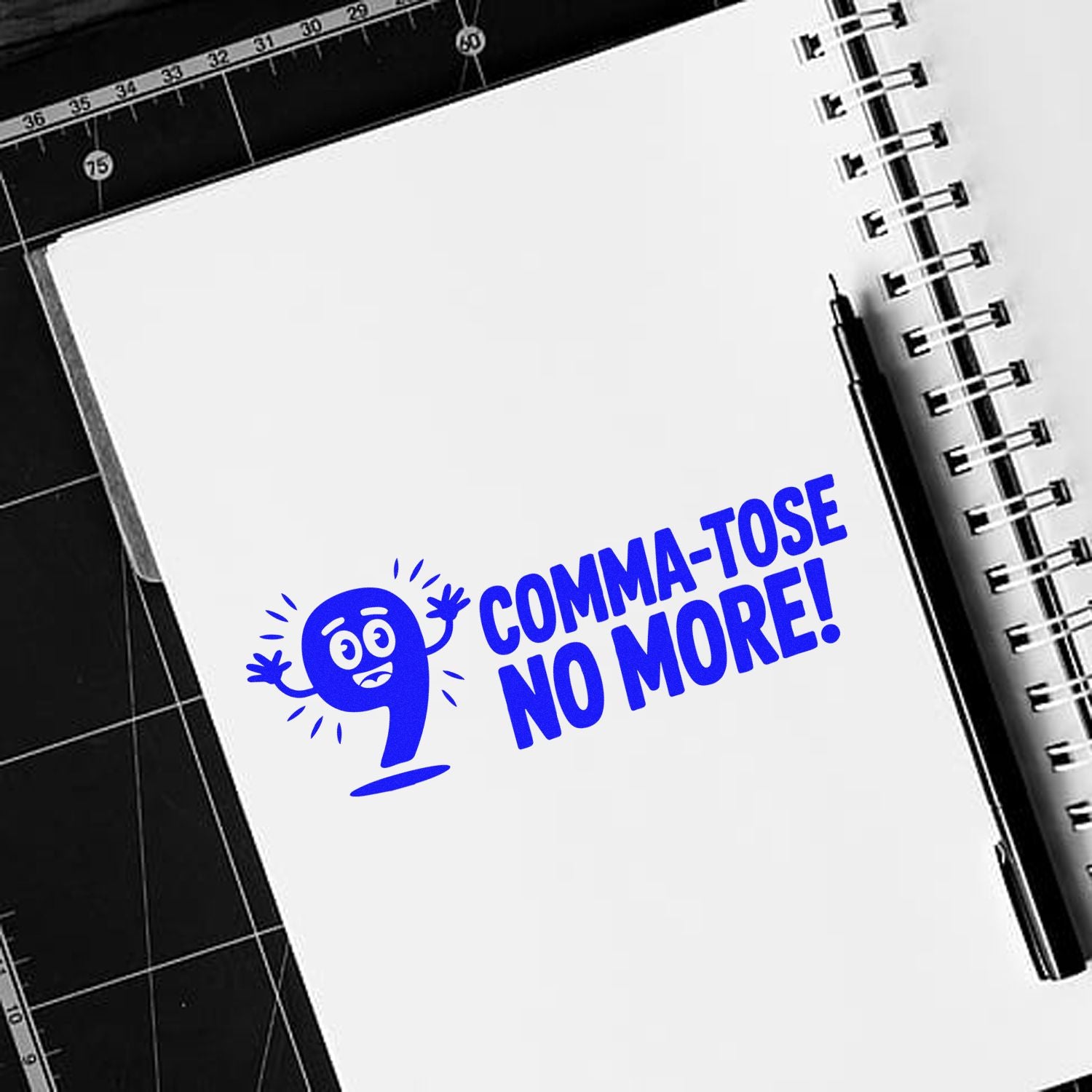 Blue custom rubber stamp design reading Comma-tose No More! for editors, teachers, and punctuation-themed gifts.