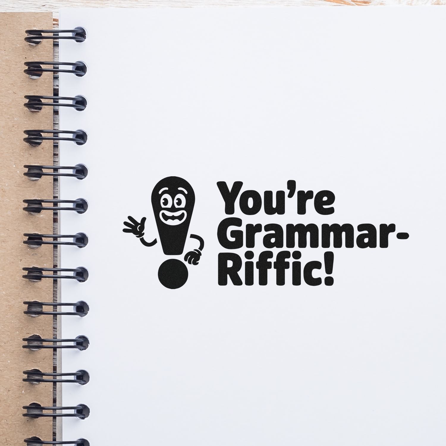Youre Grammar-Riffic! rubber stamp on notebook page, ideal for teacher feedback, classroom stationery, and proofreading gifts.