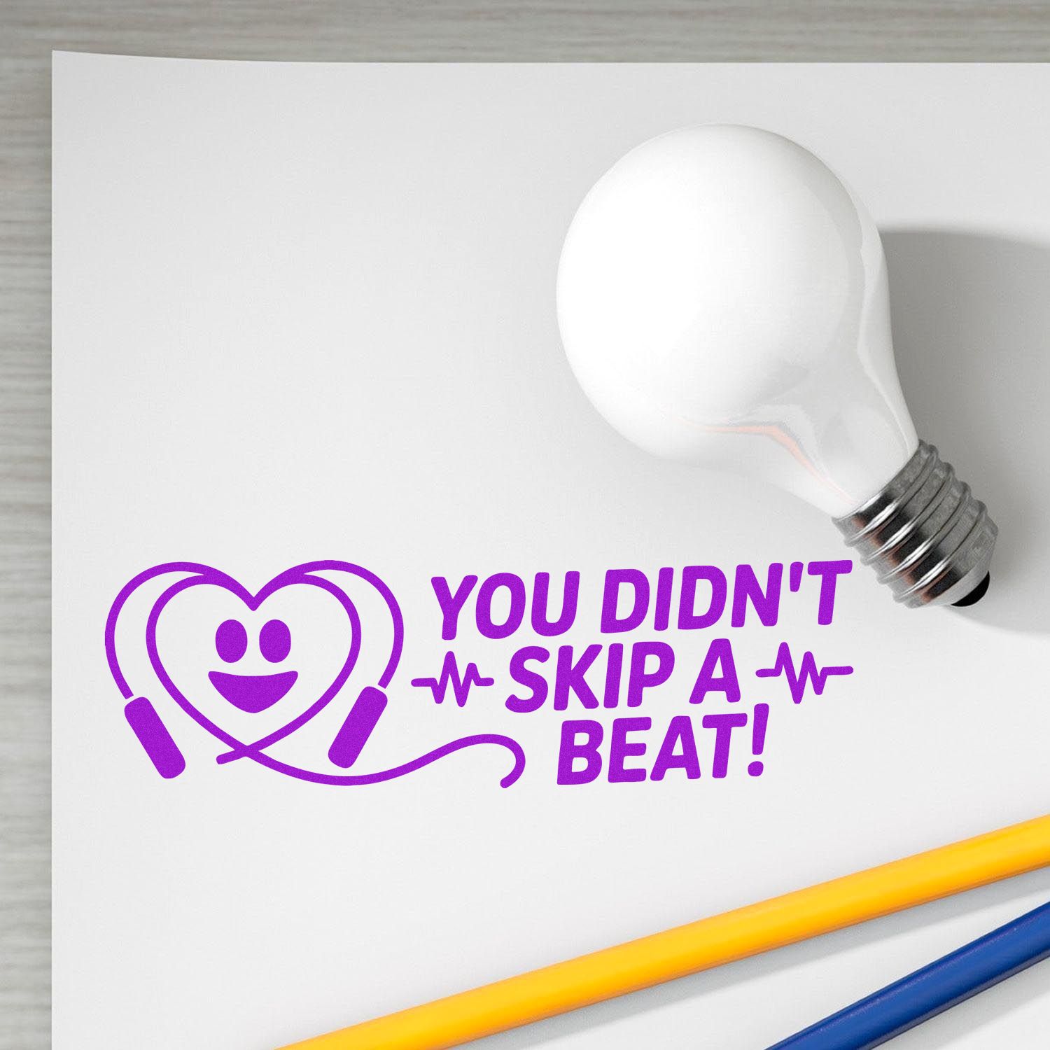 Custom rubber stamp design with heart heartbeat icon and You Didnt Skip a Beat! for baby, health, or greeting card crafts.