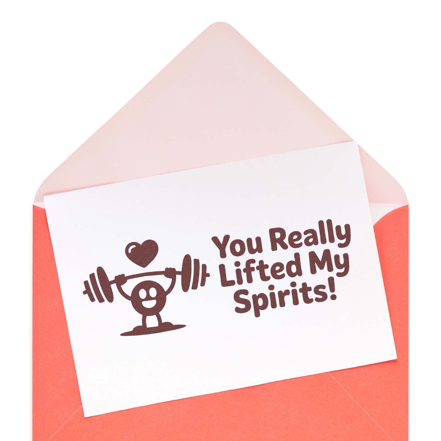 Rubber stamp design saying You Really Lifted My Spirits! with a weightlifter character and heart on a greeting card.