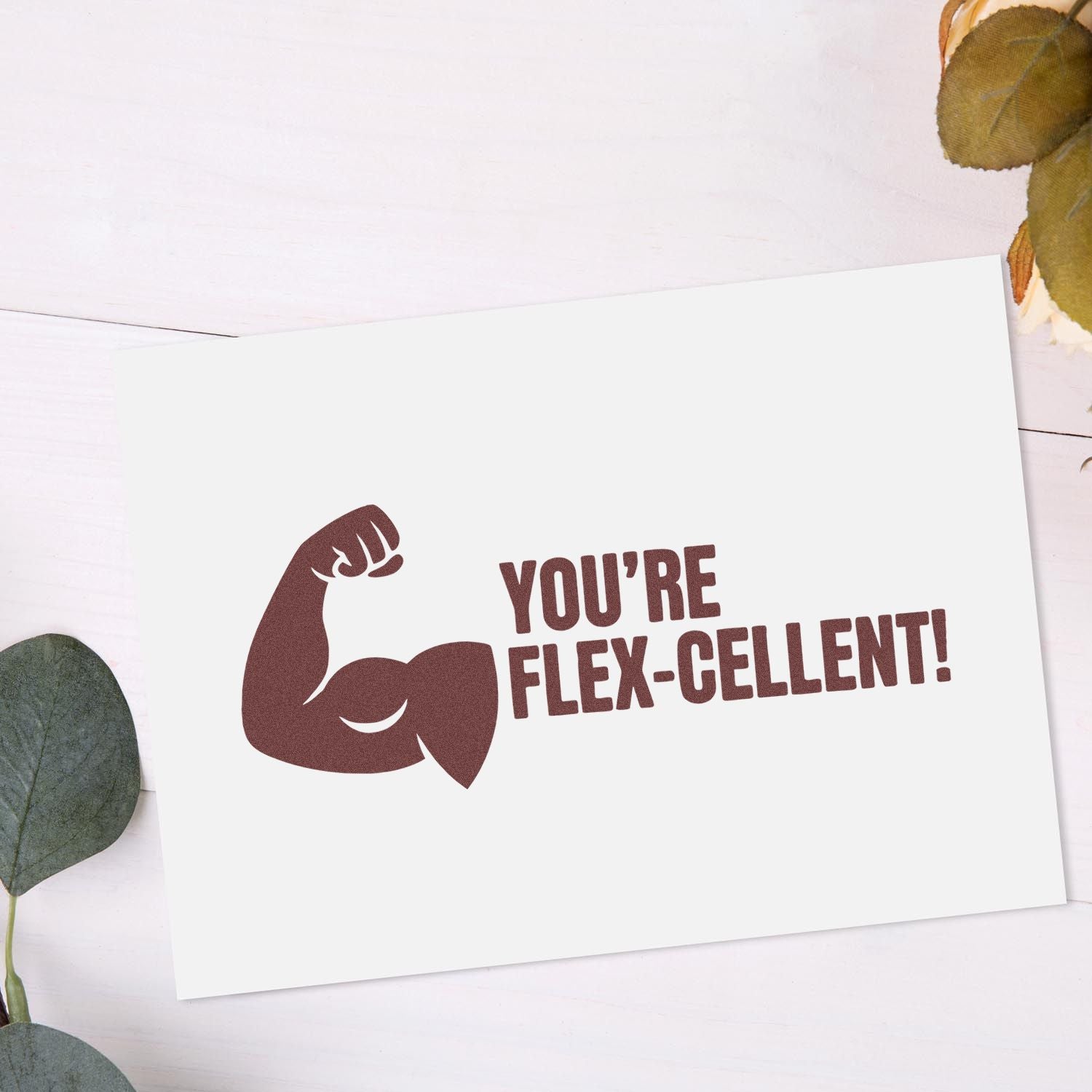 Rubber stamp mockup with flexed arm graphic and Youre Flex-cellent! message for fitness-themed encouragement cards.