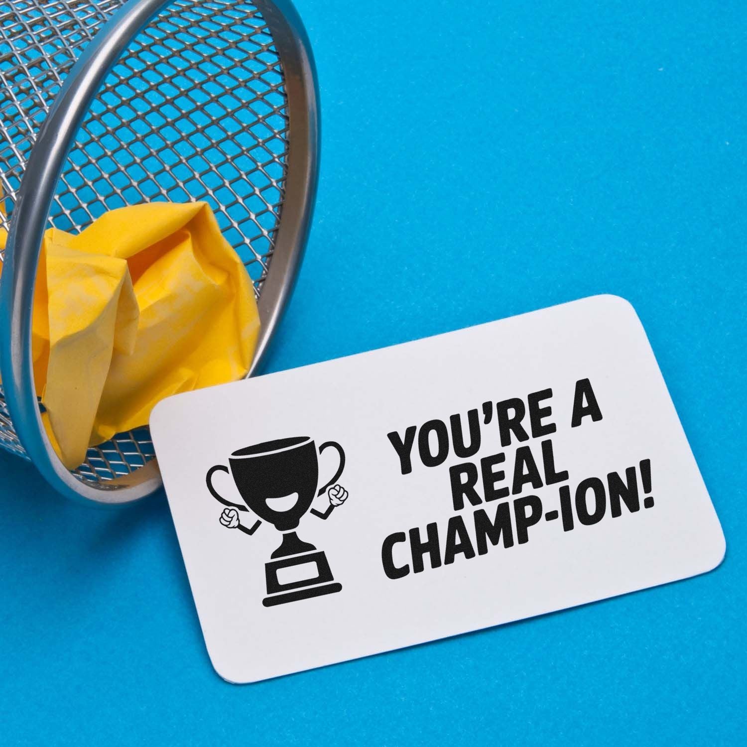 Custom rubber stamp design with trophy and Youre a real champ-ion! message for awards, praise, and appreciation.