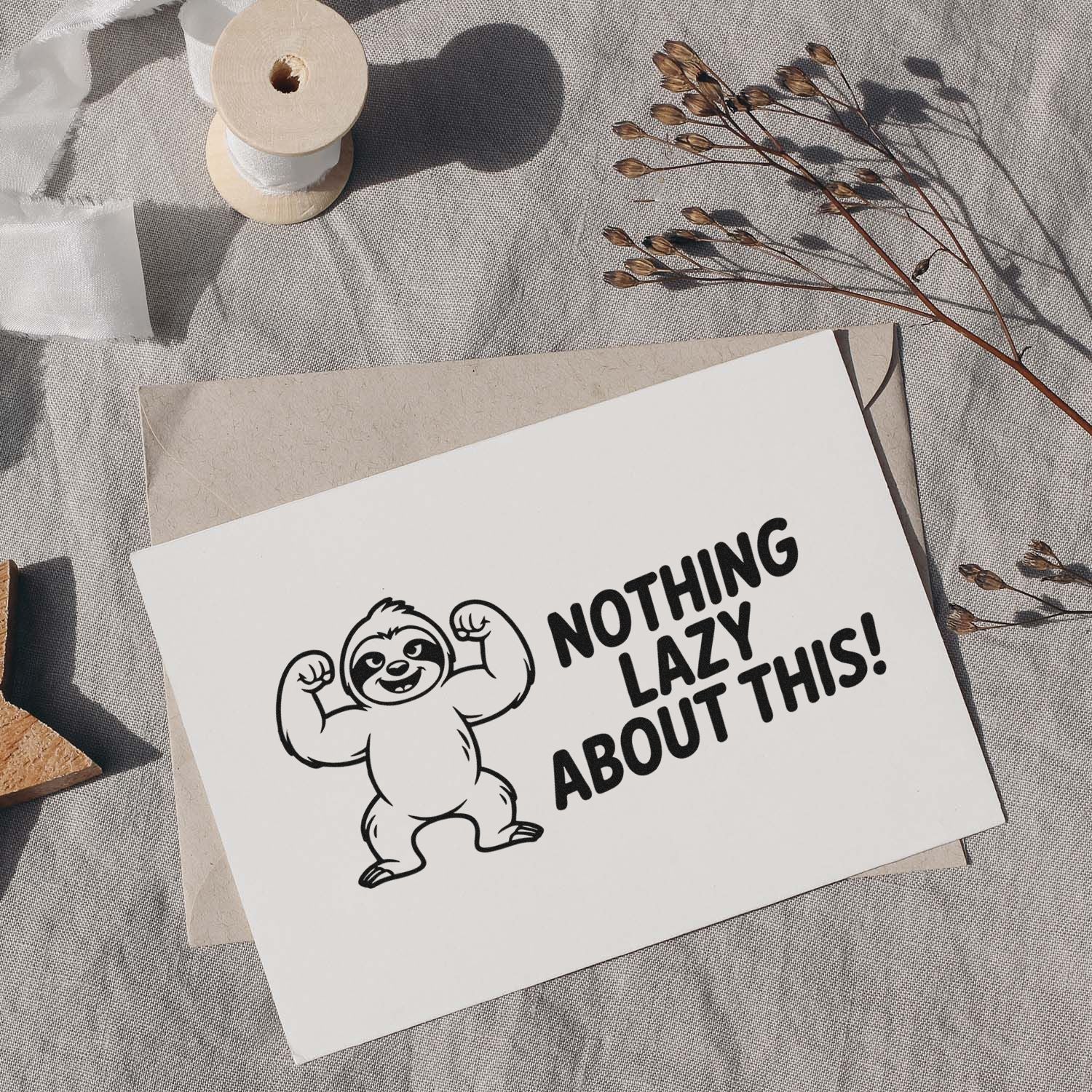 Sloth rubber stamp with Nothing Lazy About This! slogan on handmade card, ideal for playful stationery and crafts.