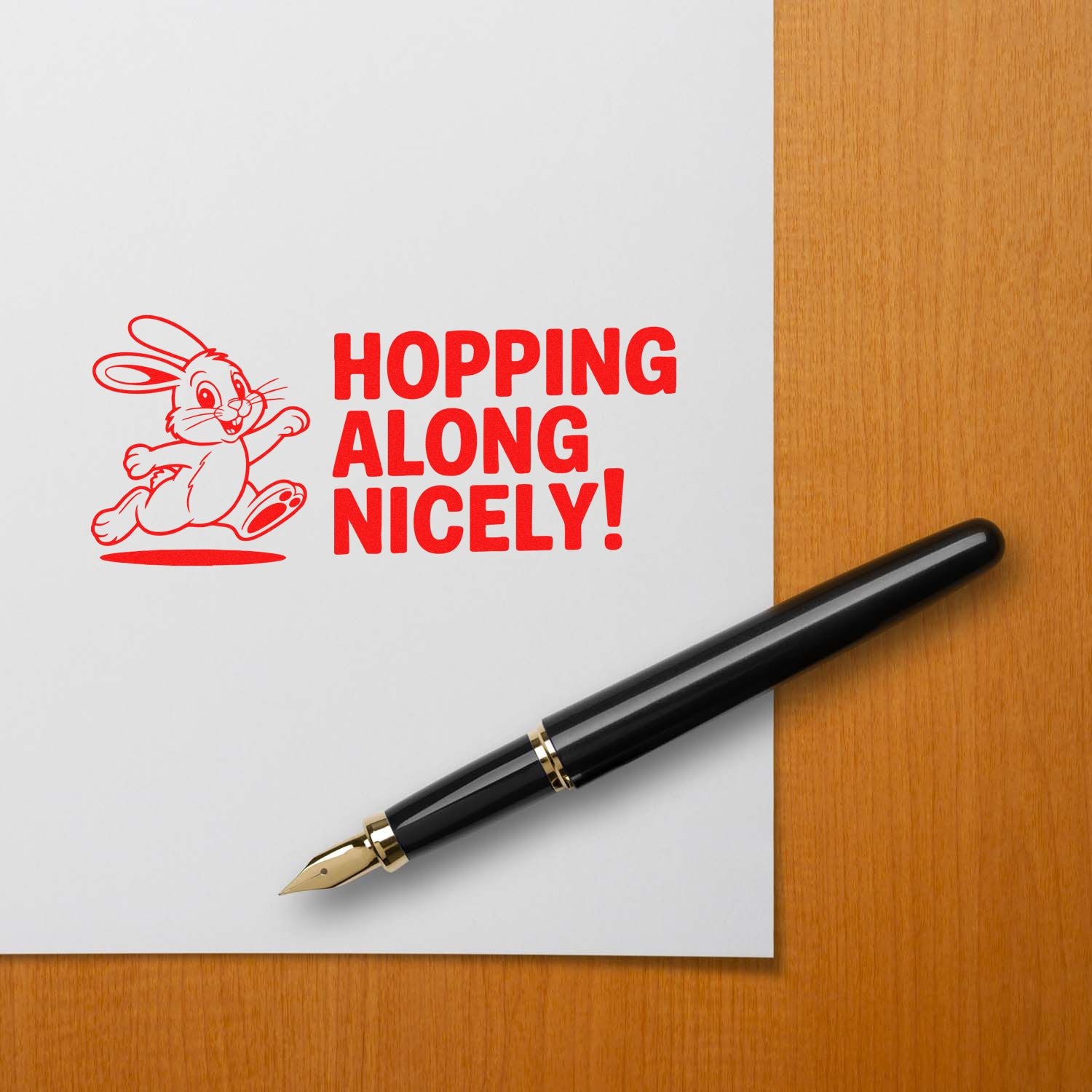 Hopping Along Nicely! bunny rubber stamp impression for Easter cards, shown in red on paper with a fountain pen.