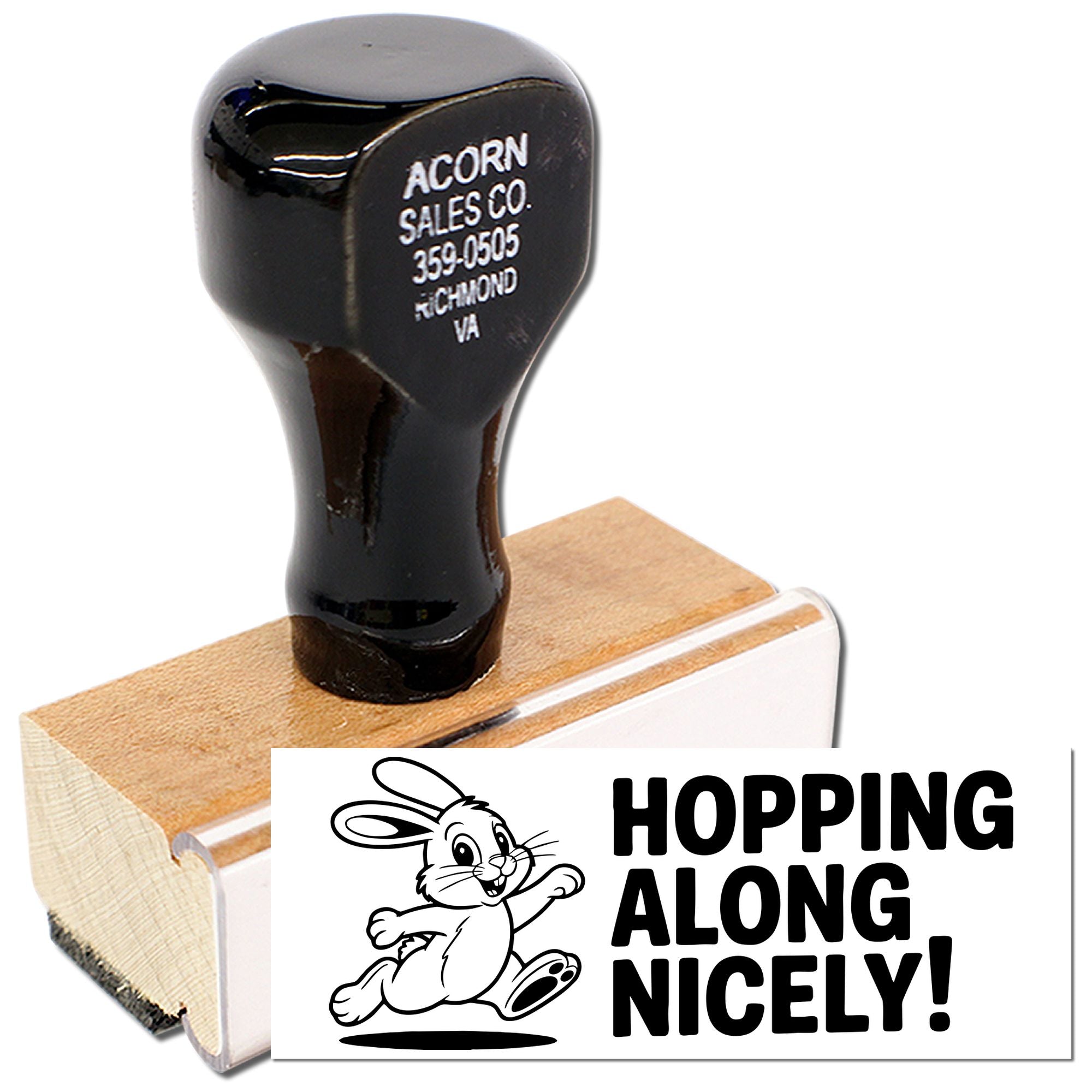 Personalized rubber stamp with rabbit design and Hopping Along Nicely! text, shown on a wood handle for craft or business use.