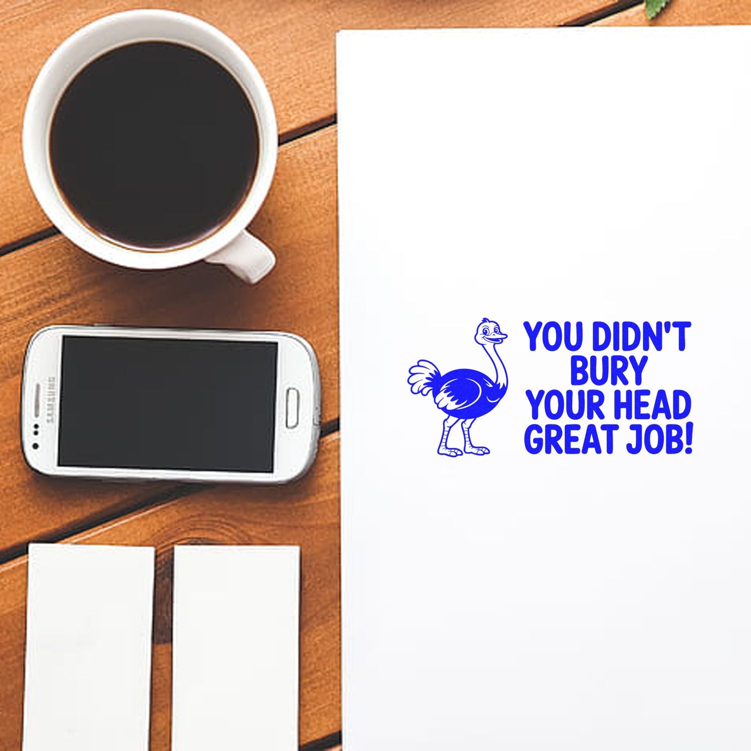 Custom rubber stamp mockup with ostrich icon and praise message: You didnt bury your head great job!