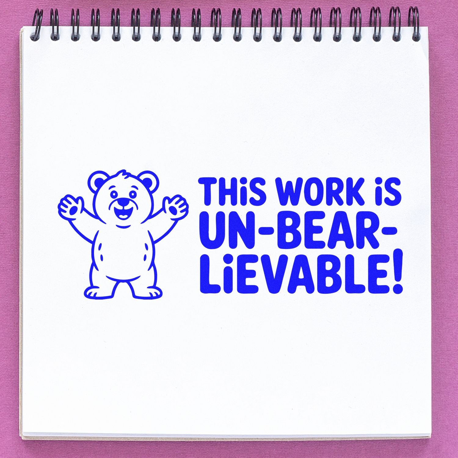 Blue bear-themed rubber stamp reading This work is un-bear-lievable! for teacher grading and student encouragement.