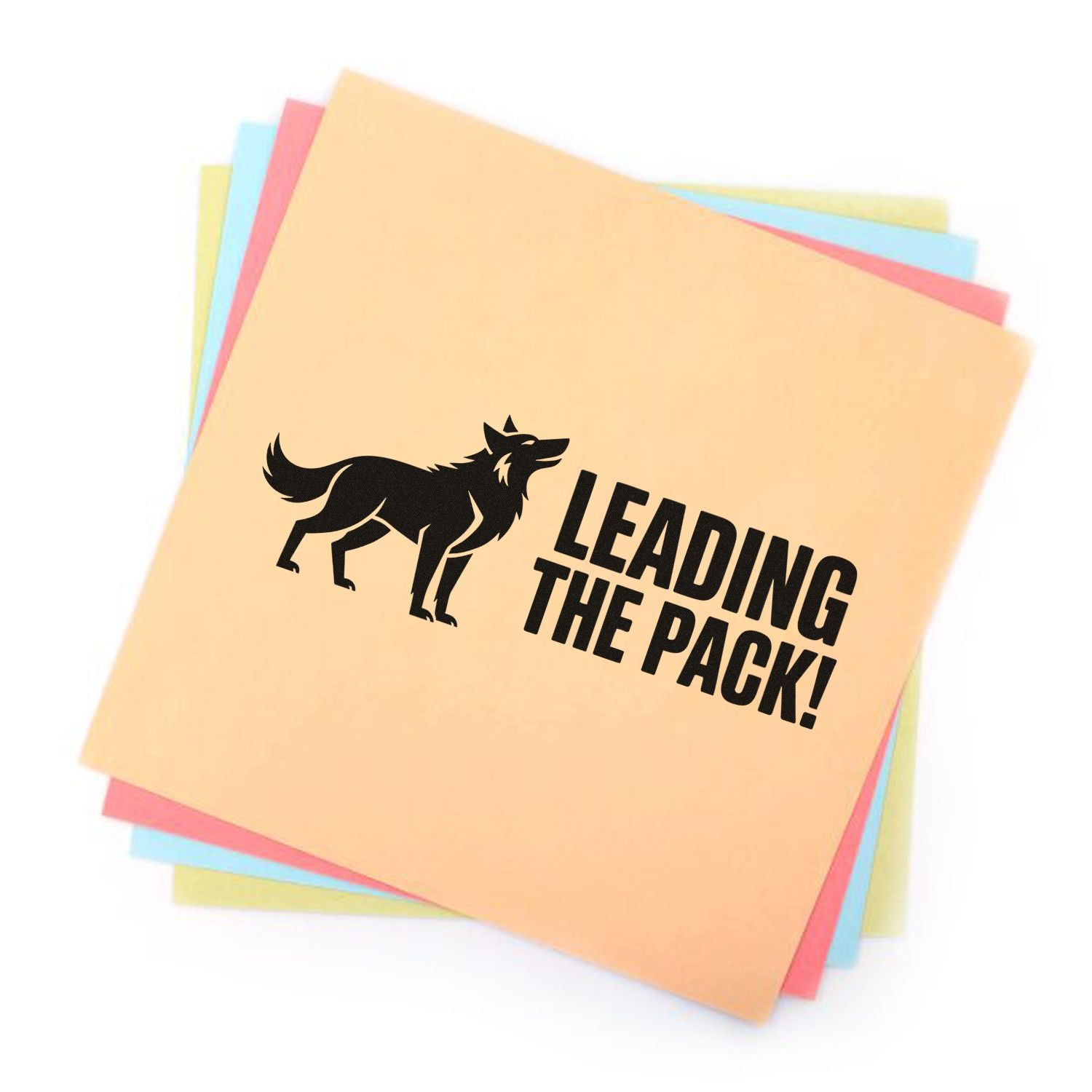 Custom rubber stamp design with wolf silhouette and Leading the Pack! on pastel paper stack