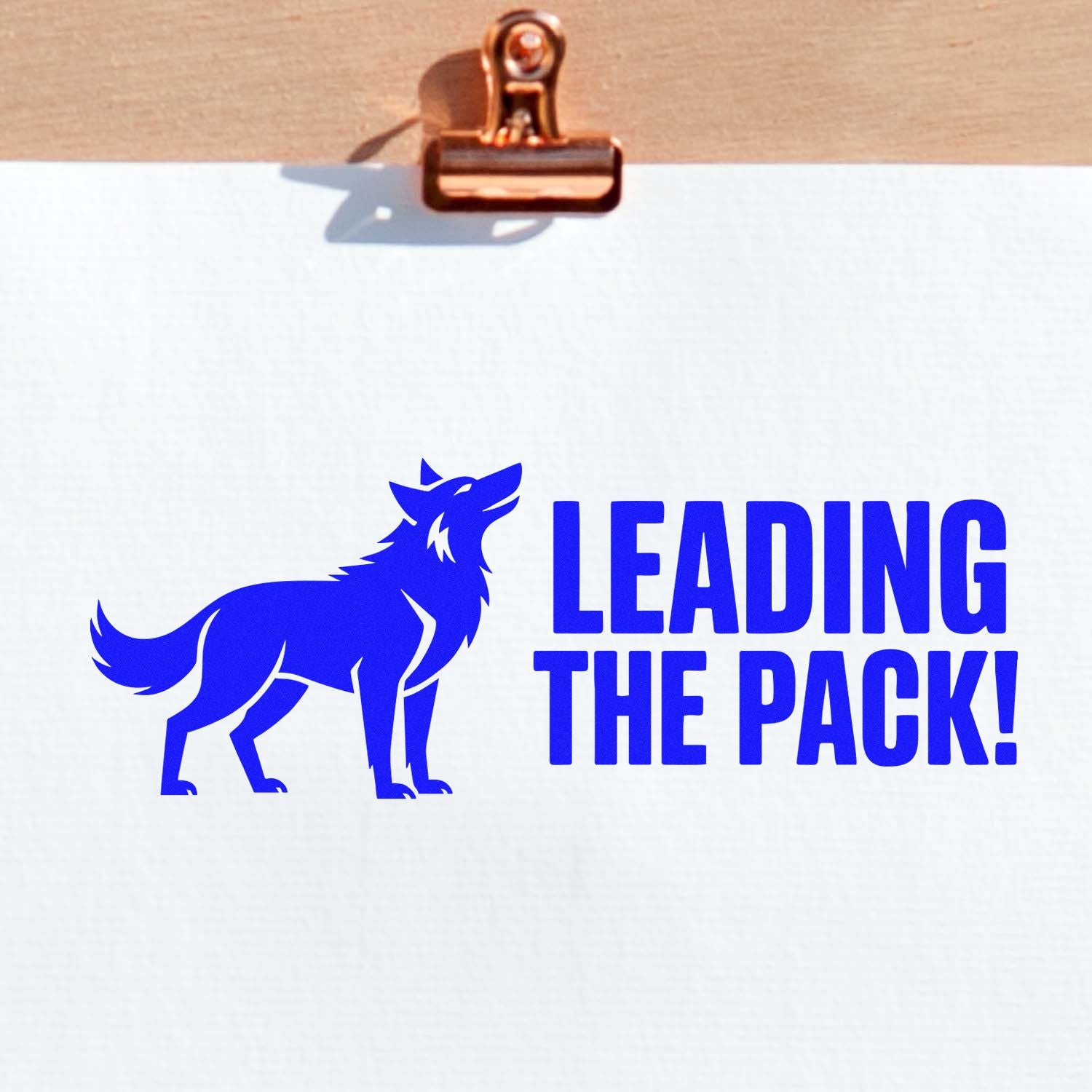 Custom logo rubber stamp with wolf design and Leading the Pack! slogan for branding, packaging, and business promotion.