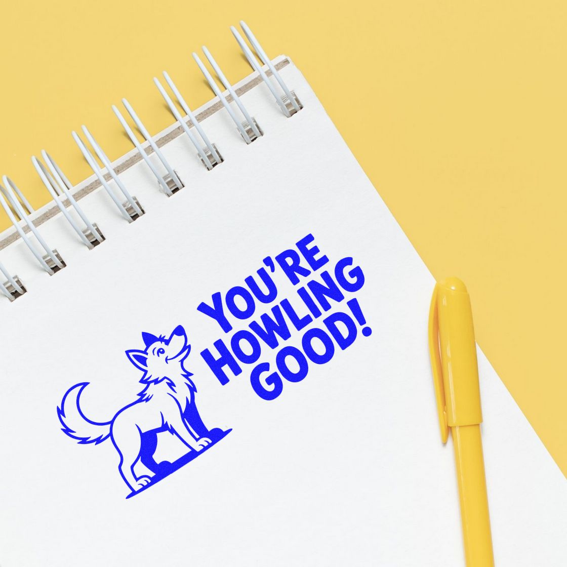 Wolf-themed rubber stamp impression reading Youre Howling Good! for playful encouragement, teacher rewards, or craft projects.