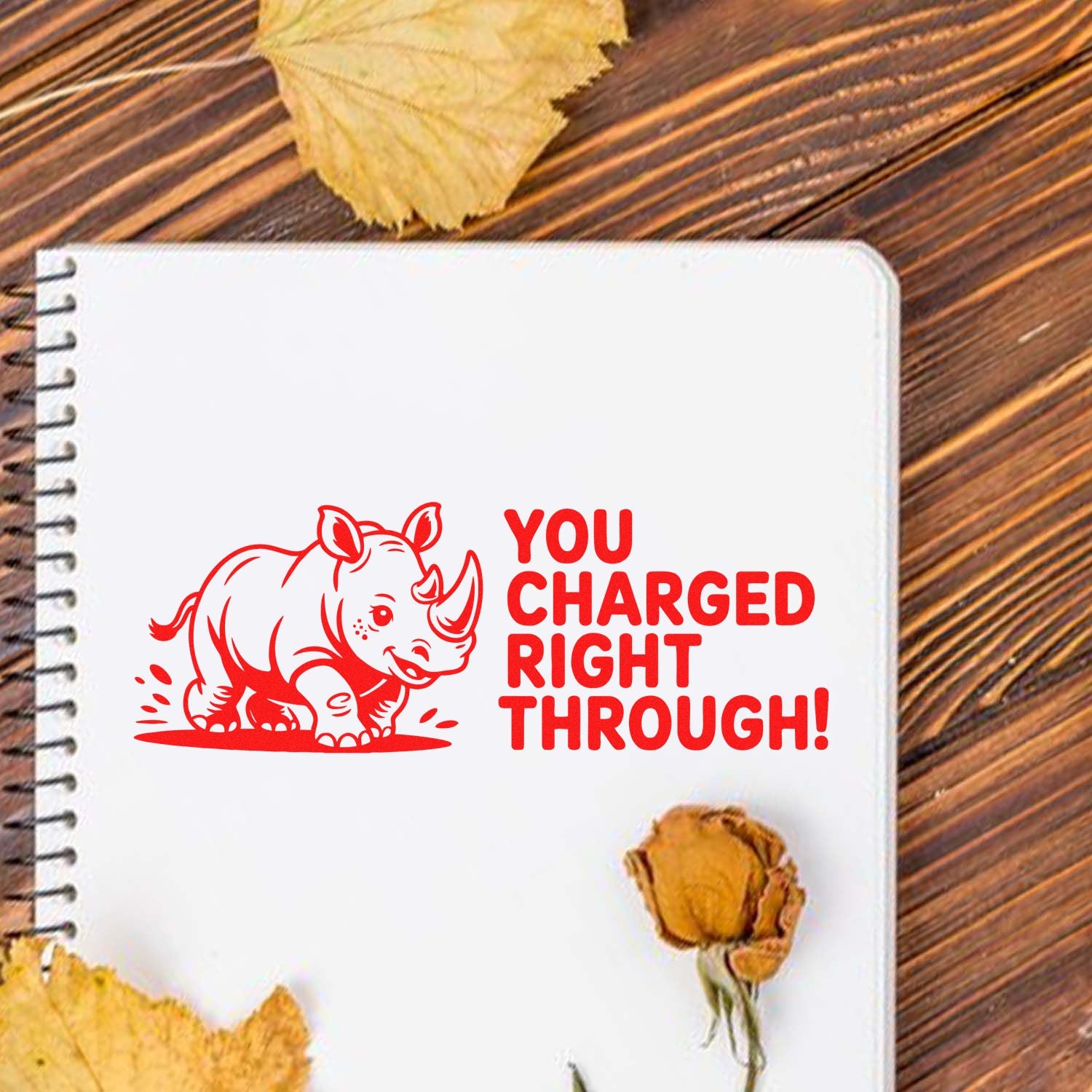 Red rhino rubber stamp design with You Charged Right Through! quote for cards, planners, and craft projects.