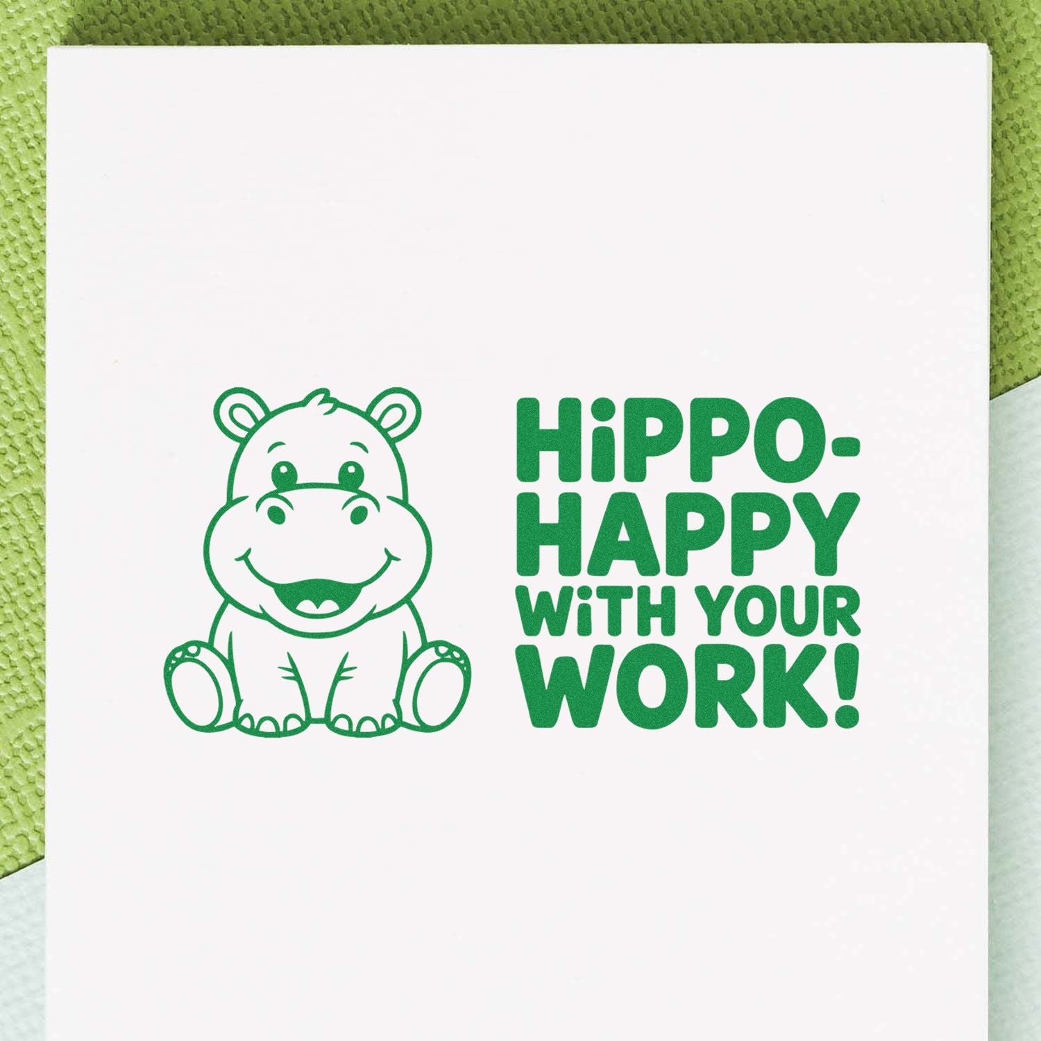 Hippo Happy With Your Work rubber stamp design with smiling hippo illustration and bold green motivational text.
