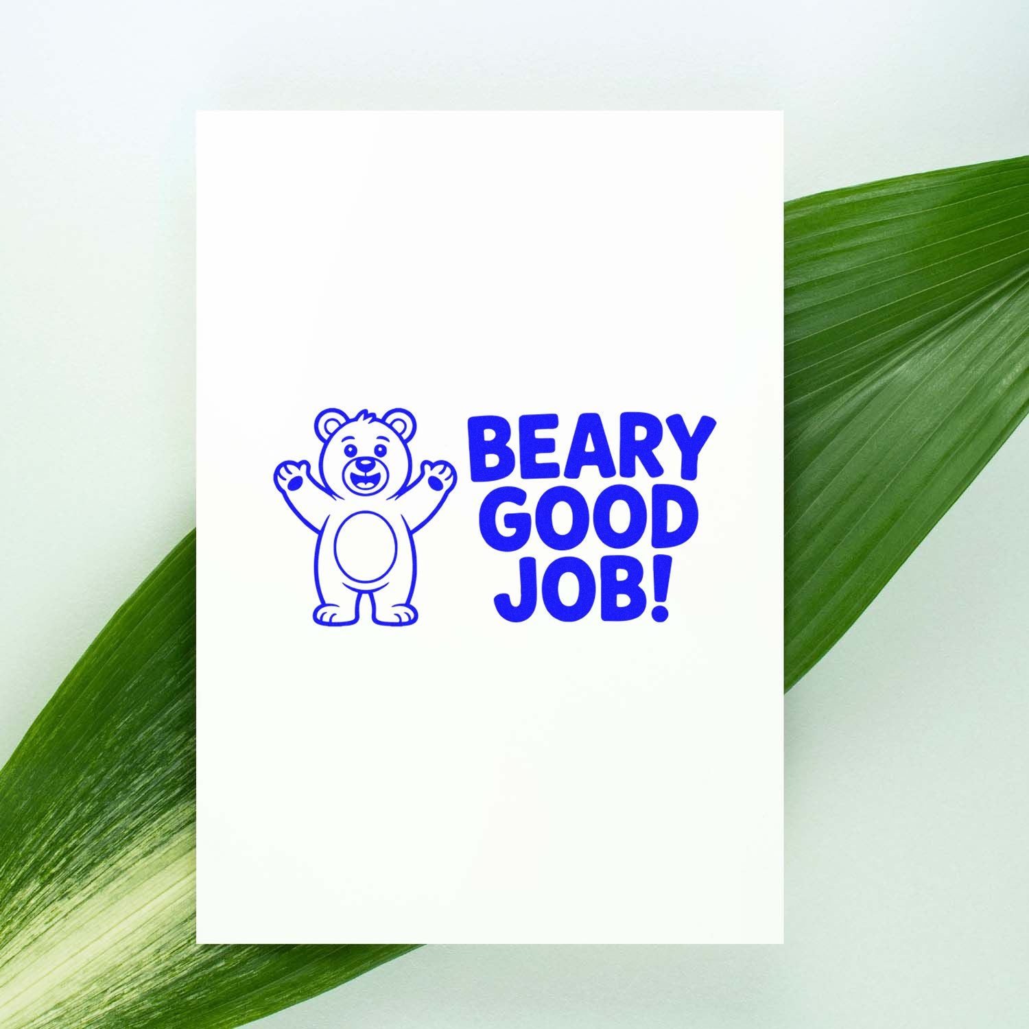 Blue Beary Good Job! bear rubber stamp on white card, ideal for teacher reward stamps and kids encouragement.