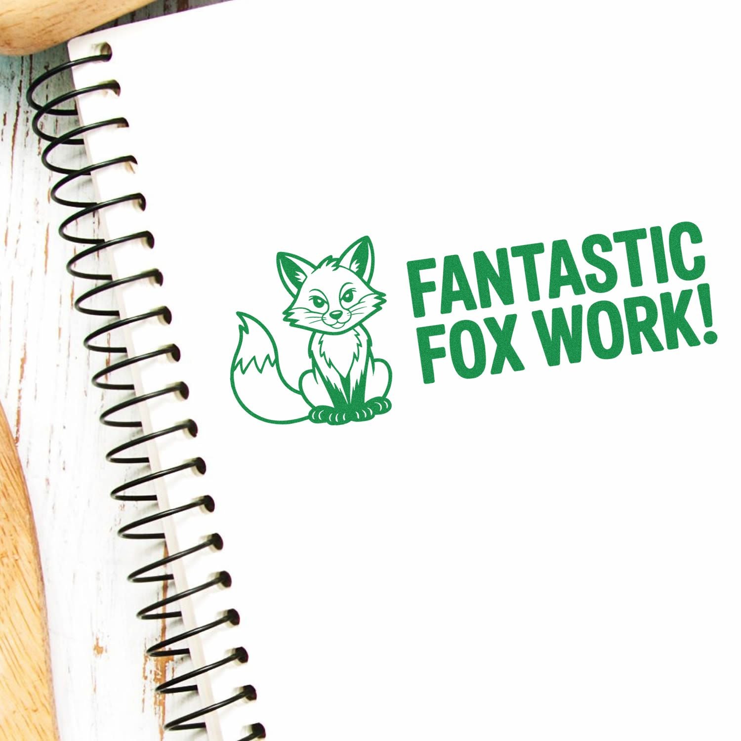Green fox rubber stamp on notebook reading Fantastic Fox Work! for positive classroom rewards and craft projects.