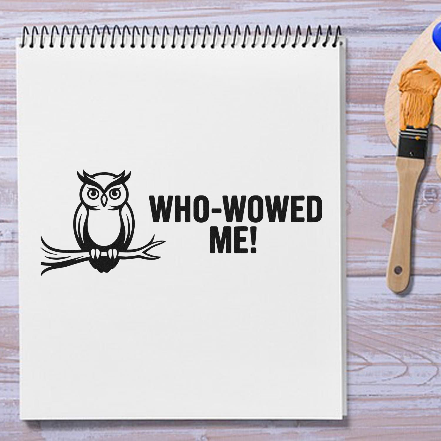 Owl rubber stamp design with Who-Wowed Me! text stamped on notebook for DIY crafts and stationery.