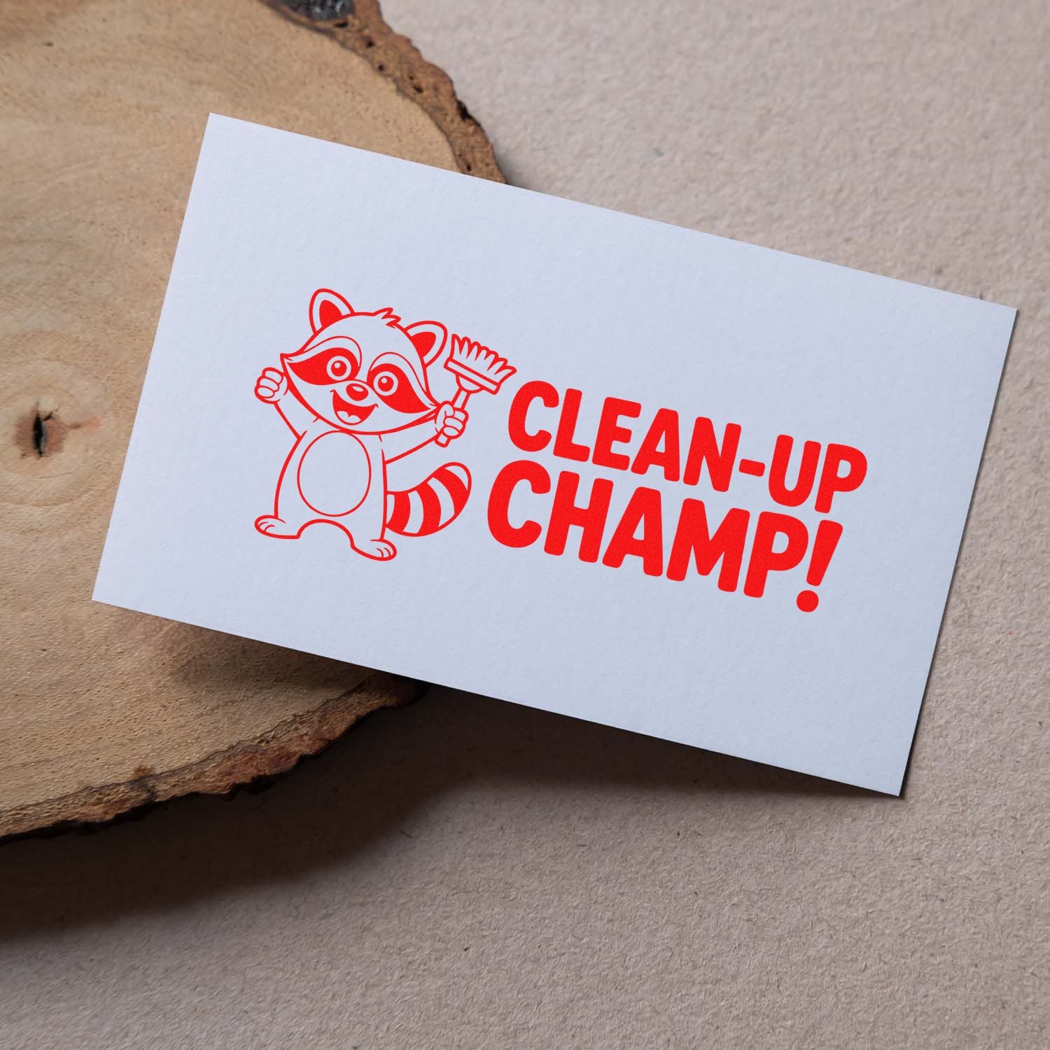 Red custom rubber stamp with raccoon and Clean-Up Champ! text for kids cleanup reward labels and incentive crafts.