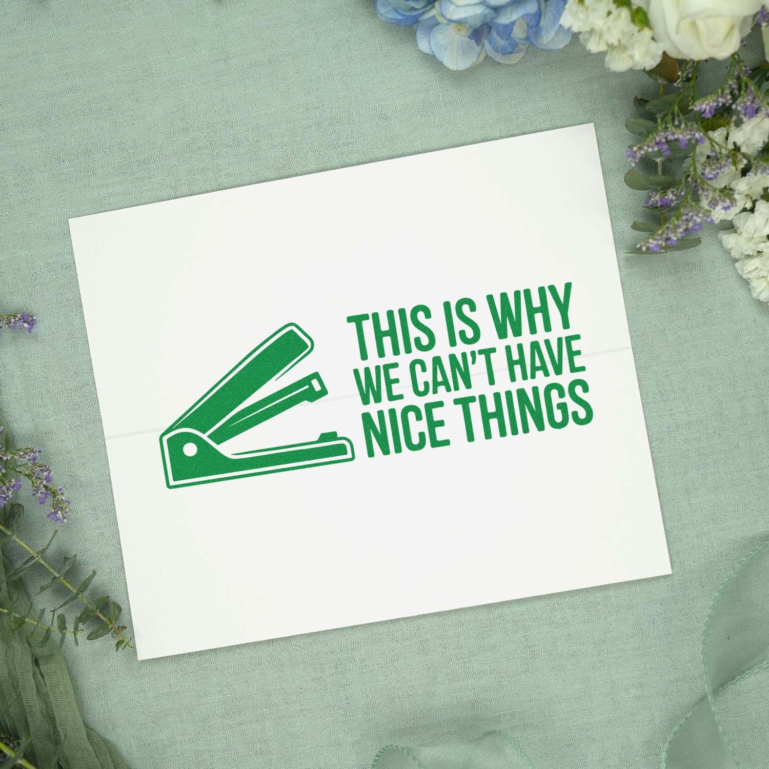 Humorous rubber stamp design with an office stapler icon and This is why we cant have nice things quote for craft cards.