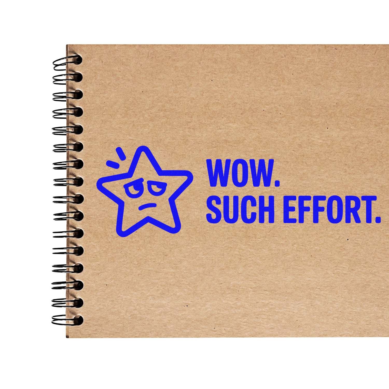 Blue rubber stamp design reading WOW. SUCH EFFORT. with star face on a kraft notebook cover.