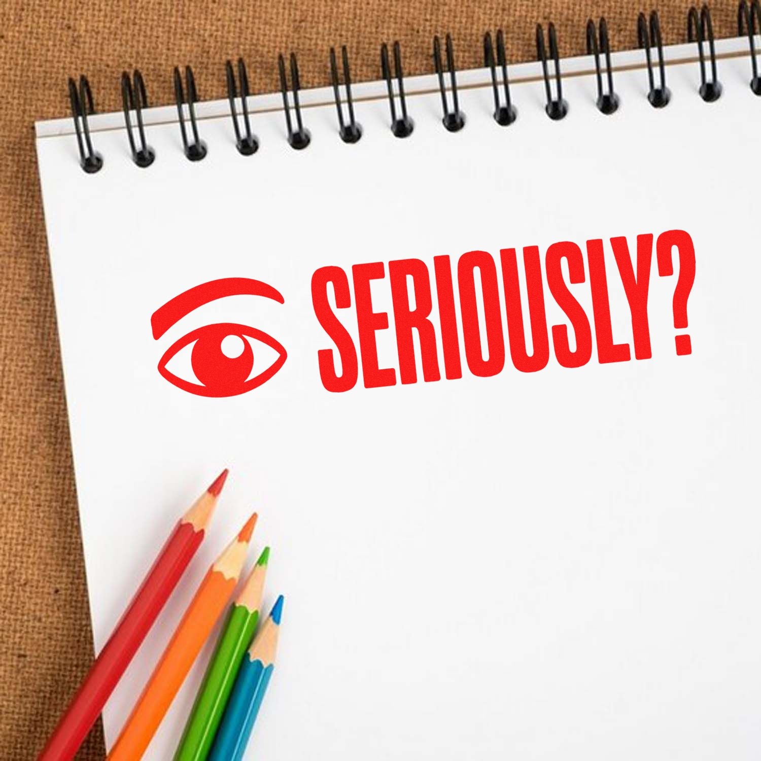 Red "Seriously?" rubber stamp design with eye icon on notebook, ideal for custom office, teacher, or approval stamps.