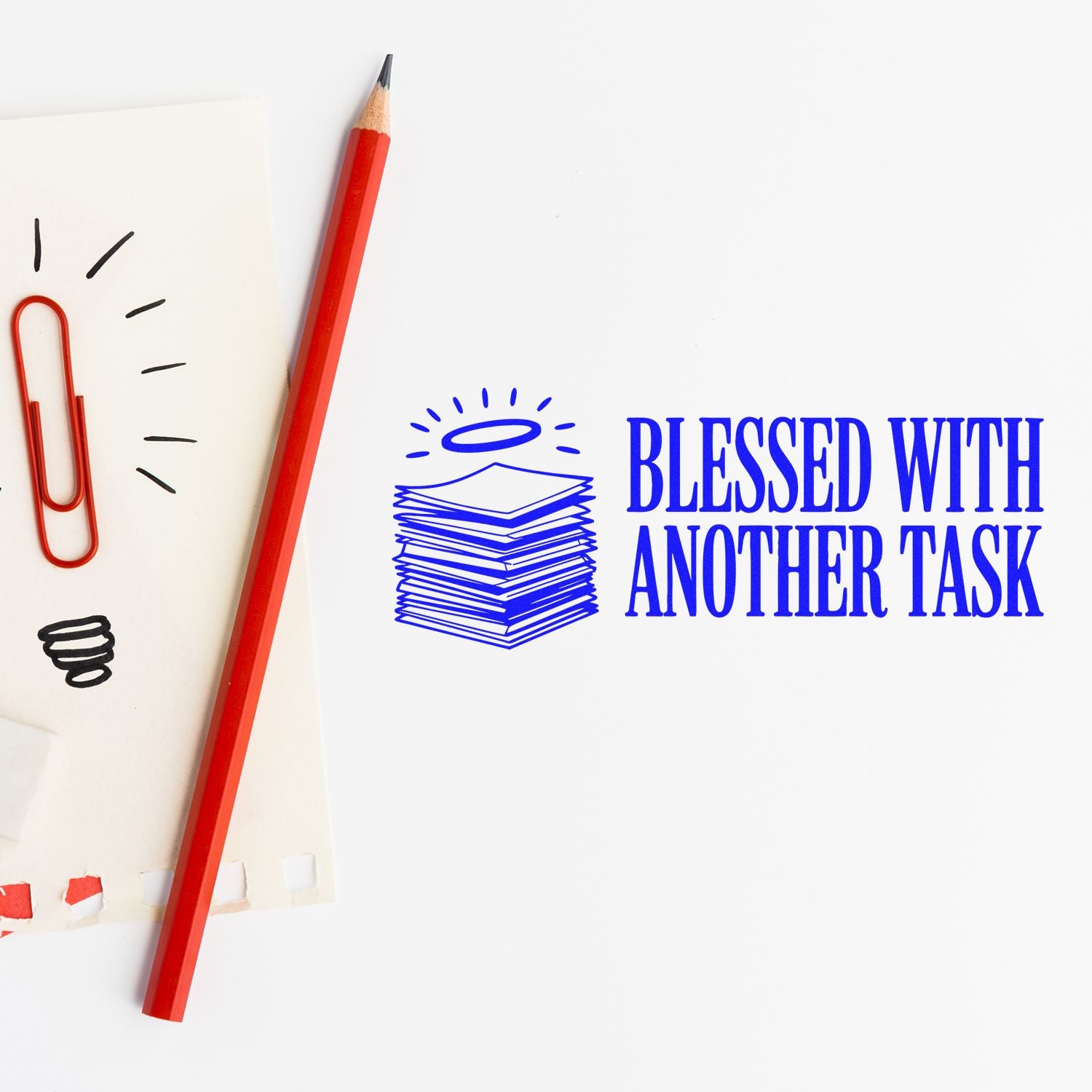 Blue rubber stamp design reading Blessed With Another Task with stacked papers and halo icon.