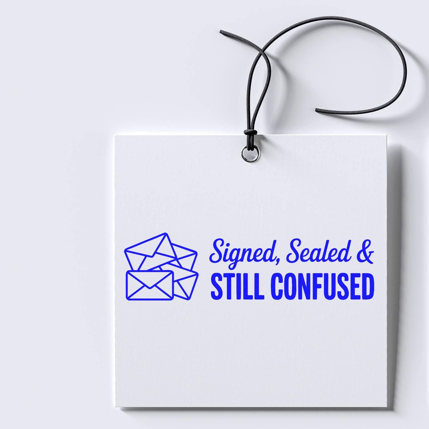 Signed, Sealed & Still Confused custom rubber stamp design with envelope icon on a hanging white card.