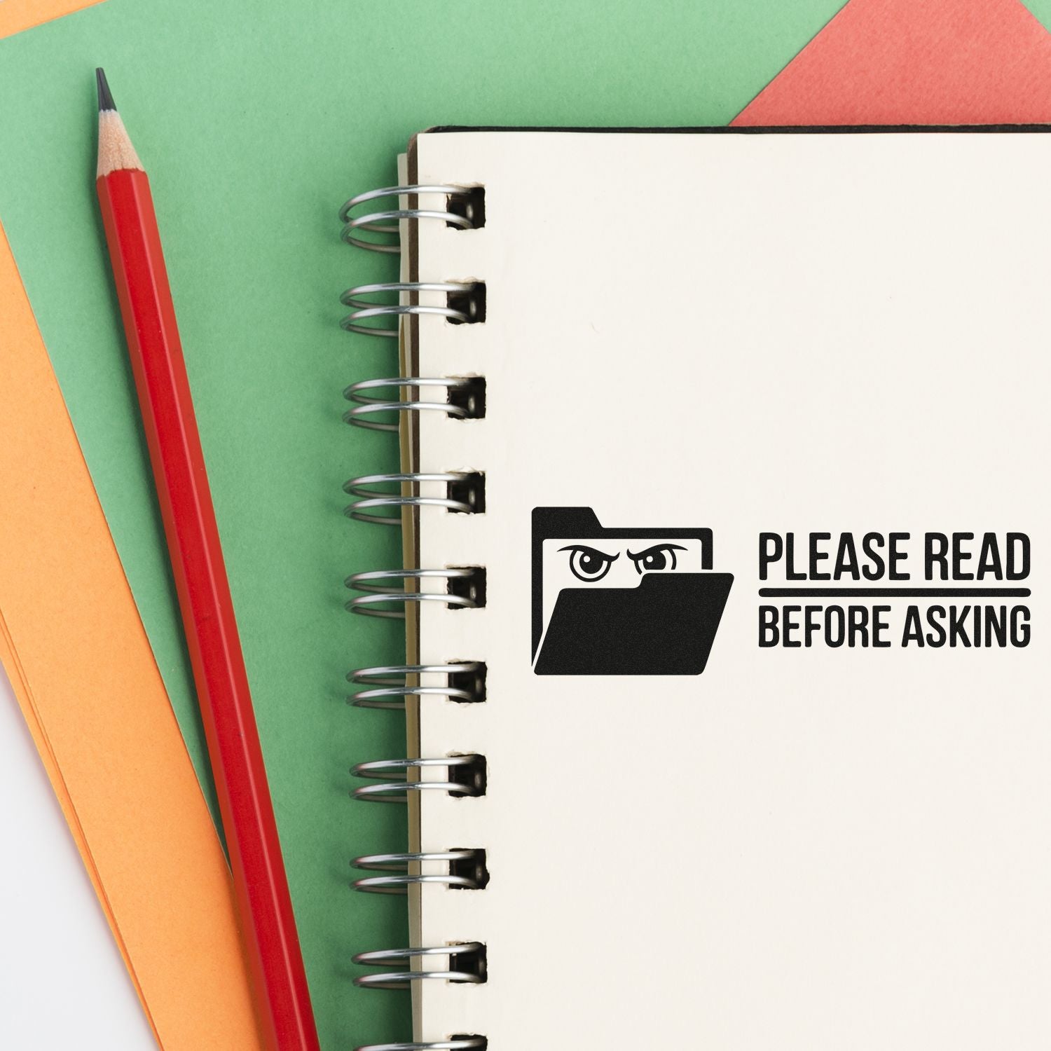 Custom rubber stamp reading Please Read Before Asking on a notebook, ideal for office reminders and document organization.