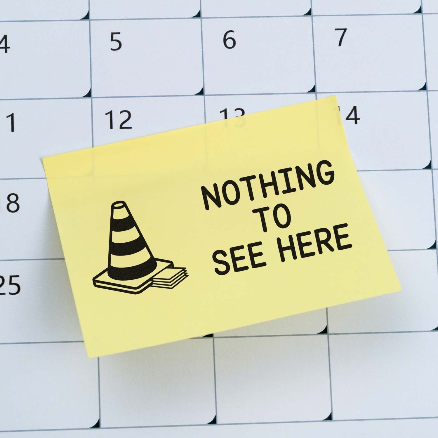 Humorous rubber stamp design reading Nothing to See Here on a calendar note for office planning and privacy.