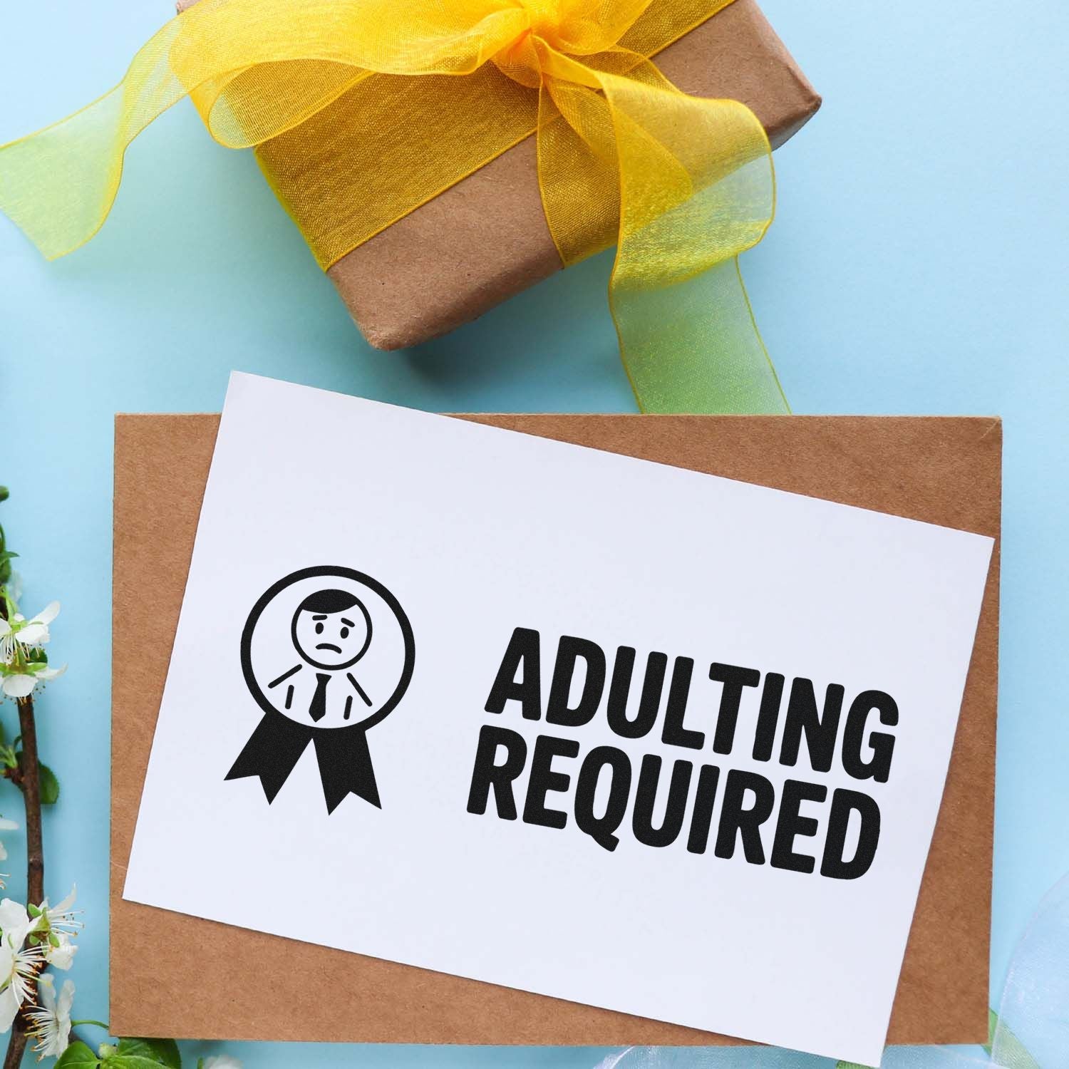 Adulting Required rubber stamp on gift packaging for handmade product labeling and custom business branding.